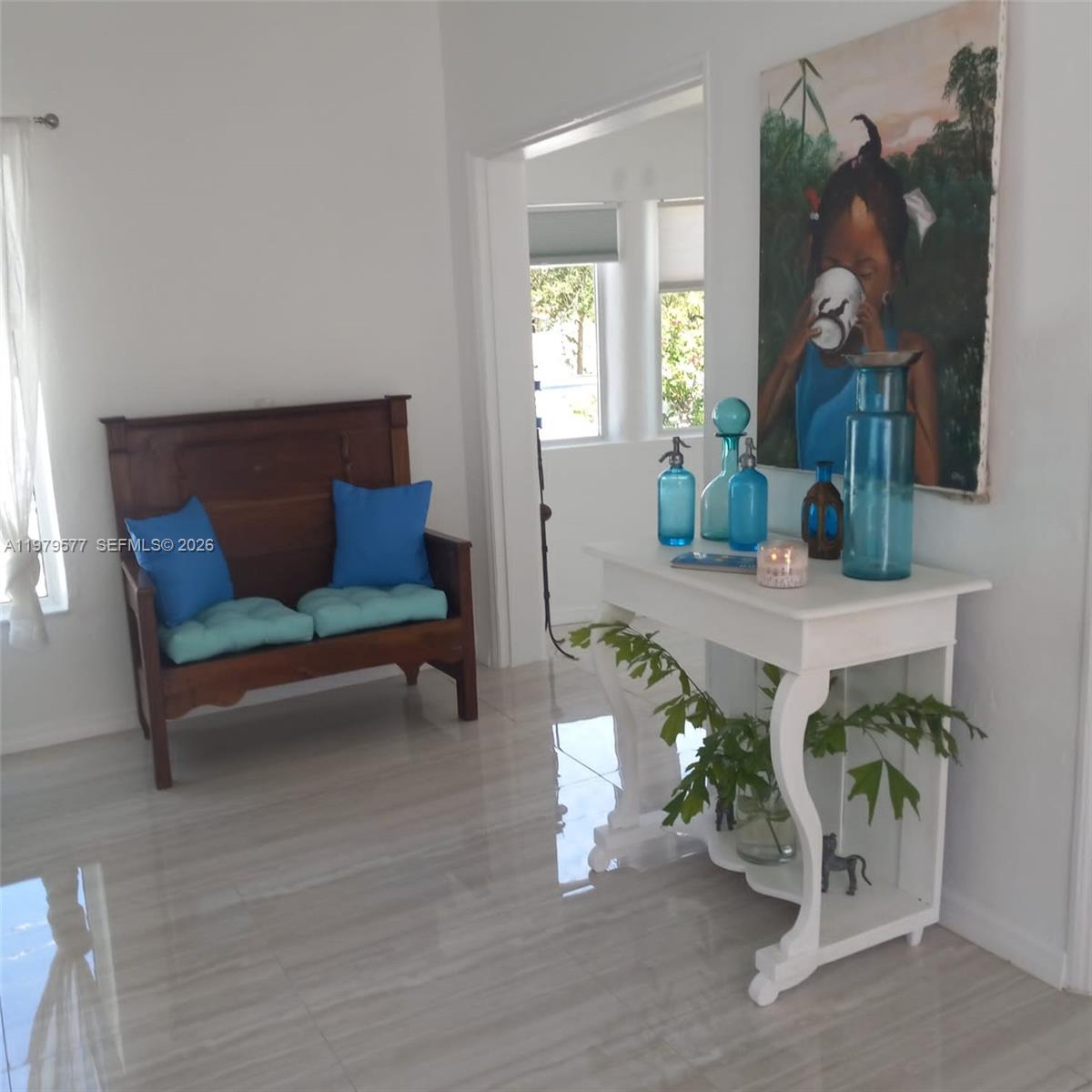 6910 Rue Notre Dame Miami Beach, FL 33141 - Photo 12 of 24 a living room with furniture and wooden floor