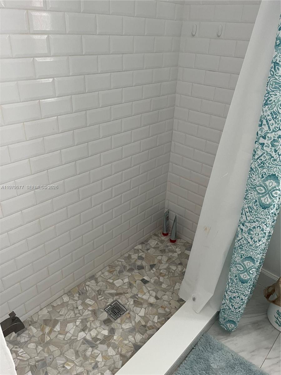 6910 Rue Notre Dame Miami Beach, FL 33141 - Photo 20 of 24 a view of a wooden door