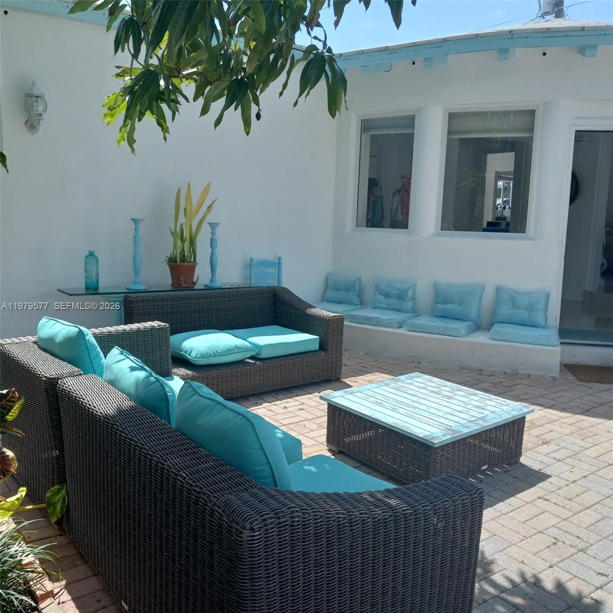 6910 Rue Notre Dame Miami Beach, FL 33141 - Photo 24 of 24 a living room with furniture and a potted plant