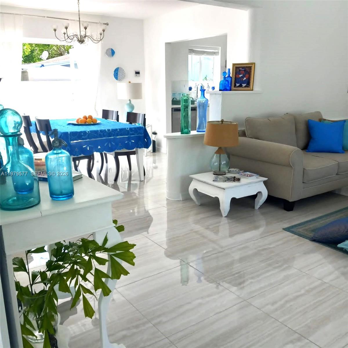 6910 Rue Notre Dame Miami Beach, FL 33141 - Photo 3 of 24 a living room with furniture and a table