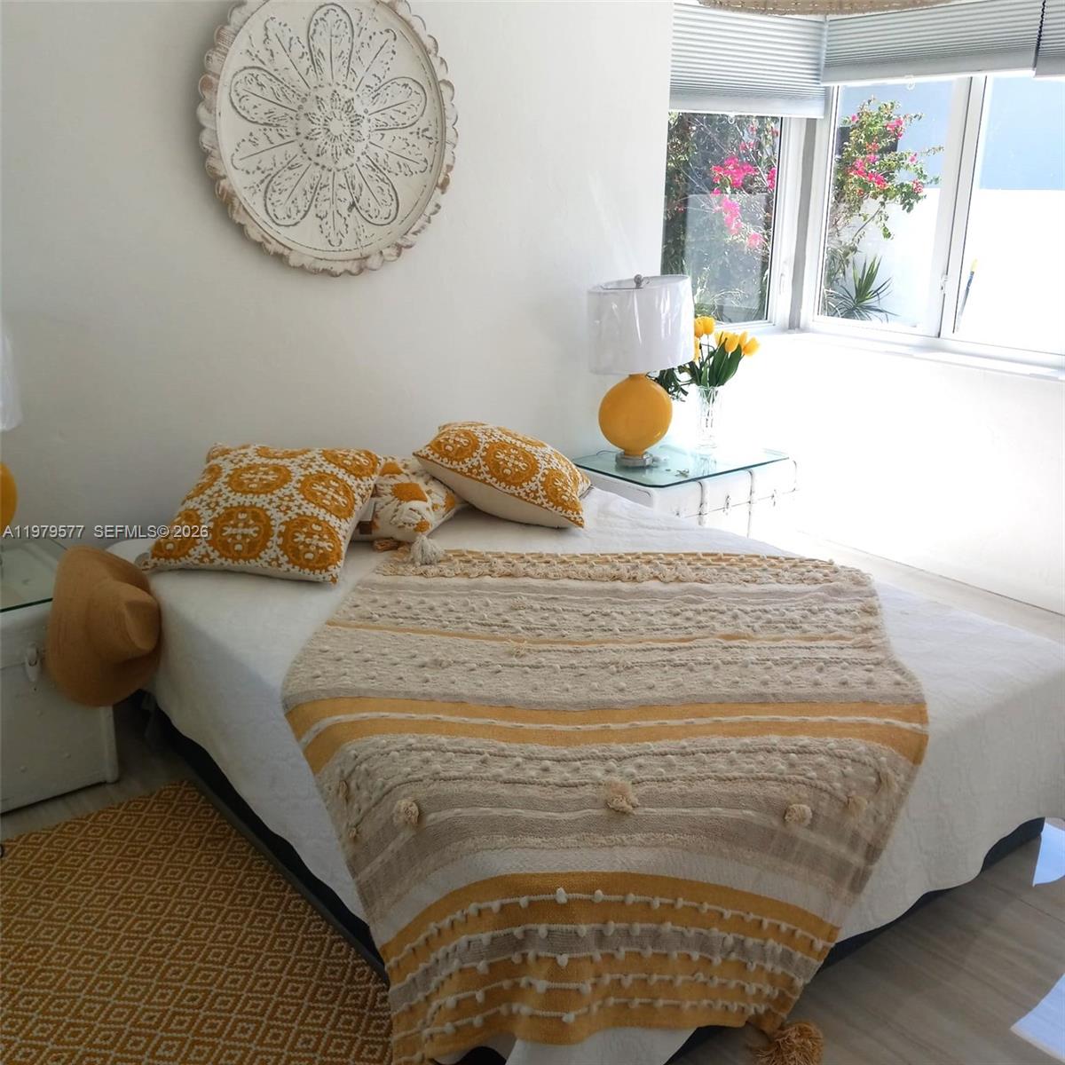 6910 Rue Notre Dame Miami Beach, FL 33141 - Photo 10 of 24 a bedroom with a bed and painting on the wall