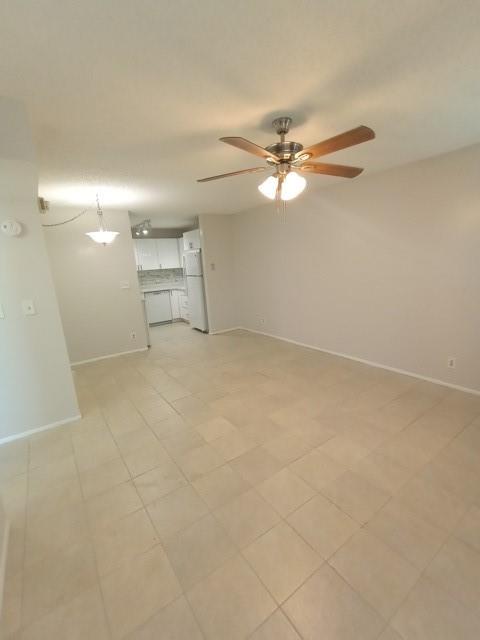 2641 Riverside Drive, Unit 5 Coral Springs, FL 33065 - Photo 20 of 27 an empty room with a ceiling fan and a fan