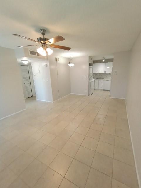 2641 Riverside Drive, Unit 5 Coral Springs, FL 33065 - Photo 21 of 27 a view of an empty room with a ceiling fan