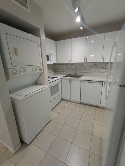 2641 Riverside Drive, Unit 5 Coral Springs, FL 33065 - Photo 22 of 27 a kitchen with a sink and cabinets