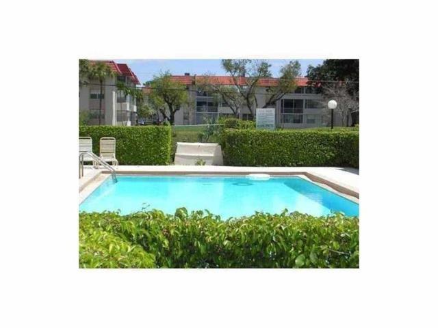 2641 Riverside Drive, Unit 5 Coral Springs, FL 33065 - Photo 25 of 27 a view of a house with a yard and sitting area