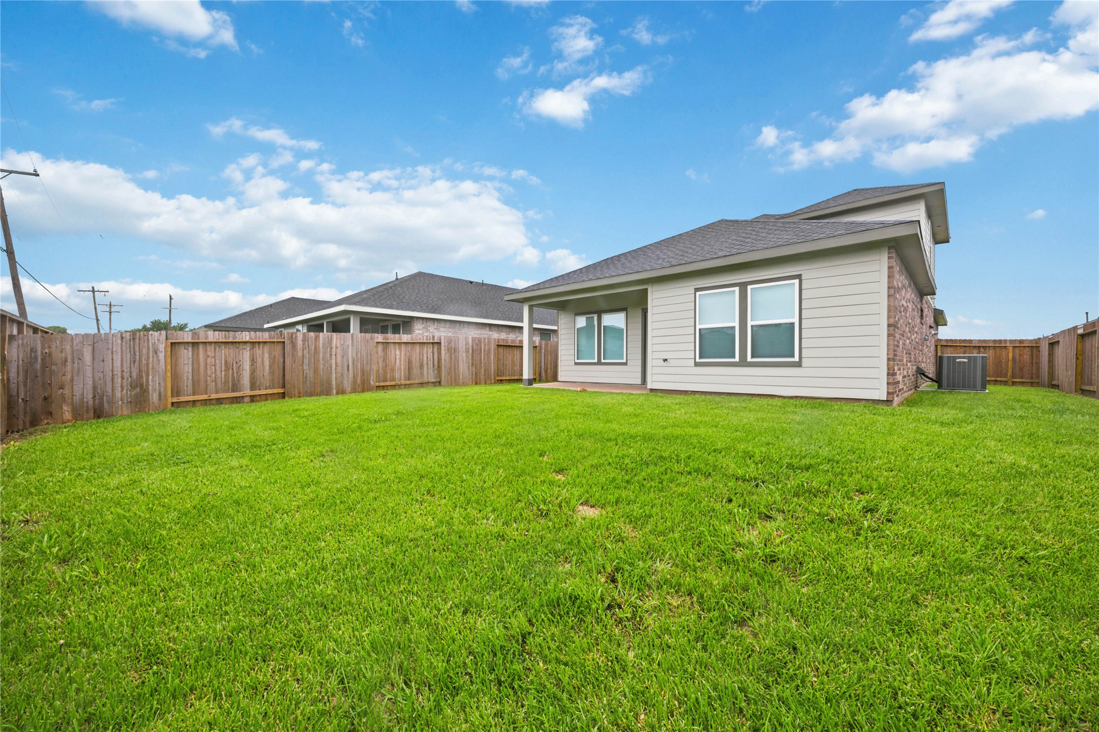 7 Robin Court Angleton, TX 77515 - Photo 26 of 27 Spacious backyard — Large fenced backyard with plenty of room for play and outdoor activities.