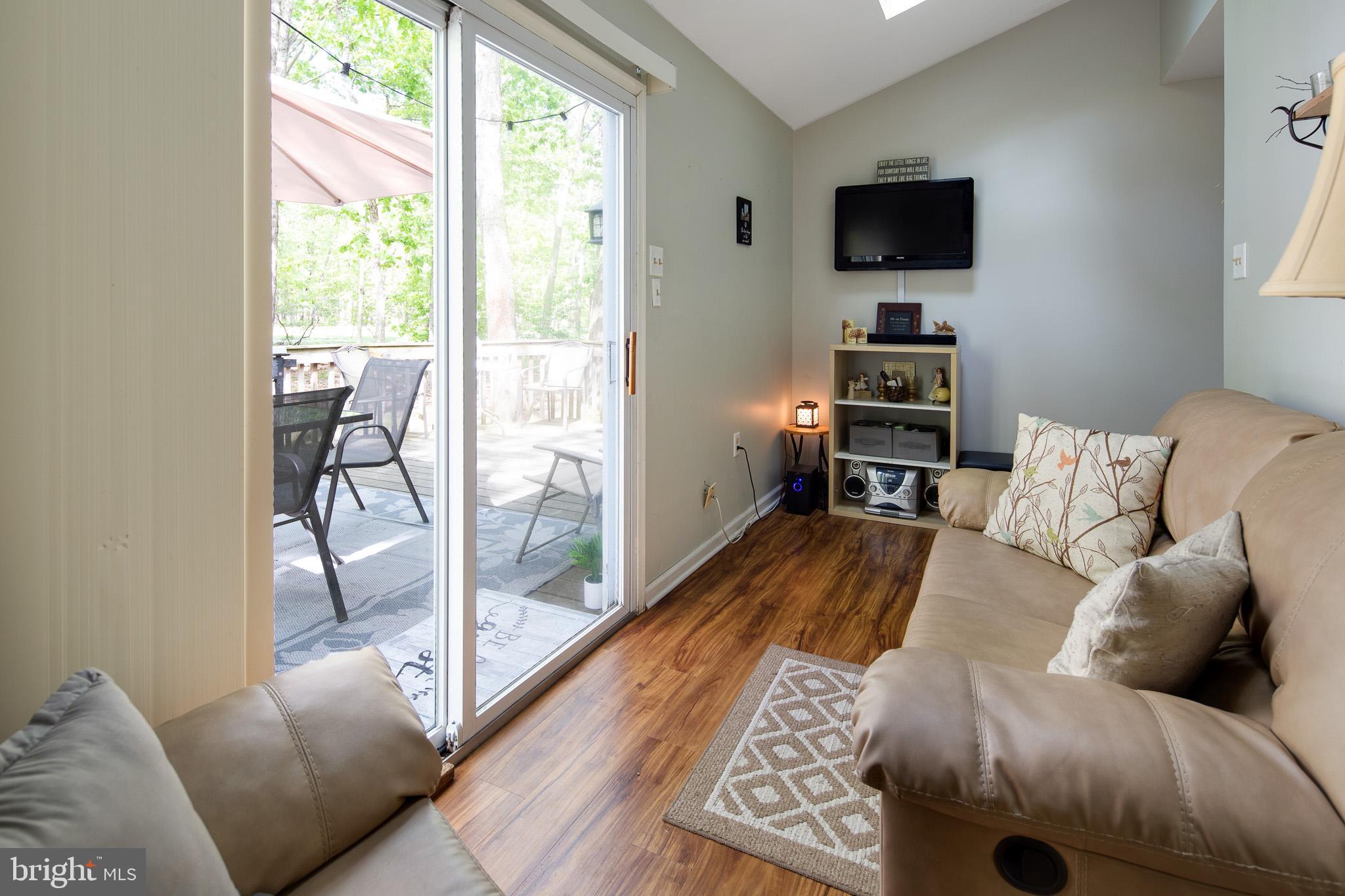 813 Whitehall Road Newfield, NJ 08344 - Photo 16 of 35 Living Room w/ access to back deck.