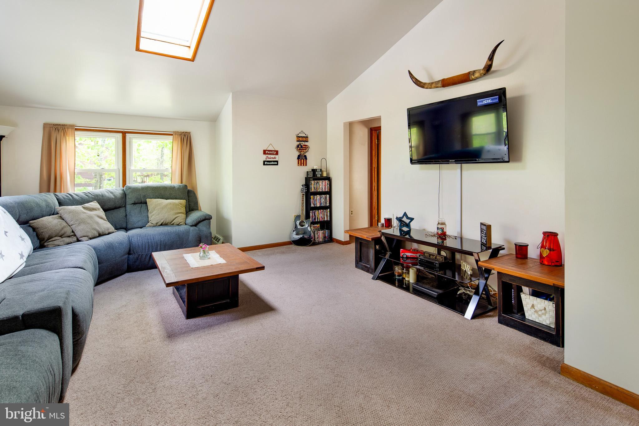 813 Whitehall Road Newfield, NJ 08344 - Photo 19 of 35 Upstairs Family Room w/ wall-to-wall carpet.