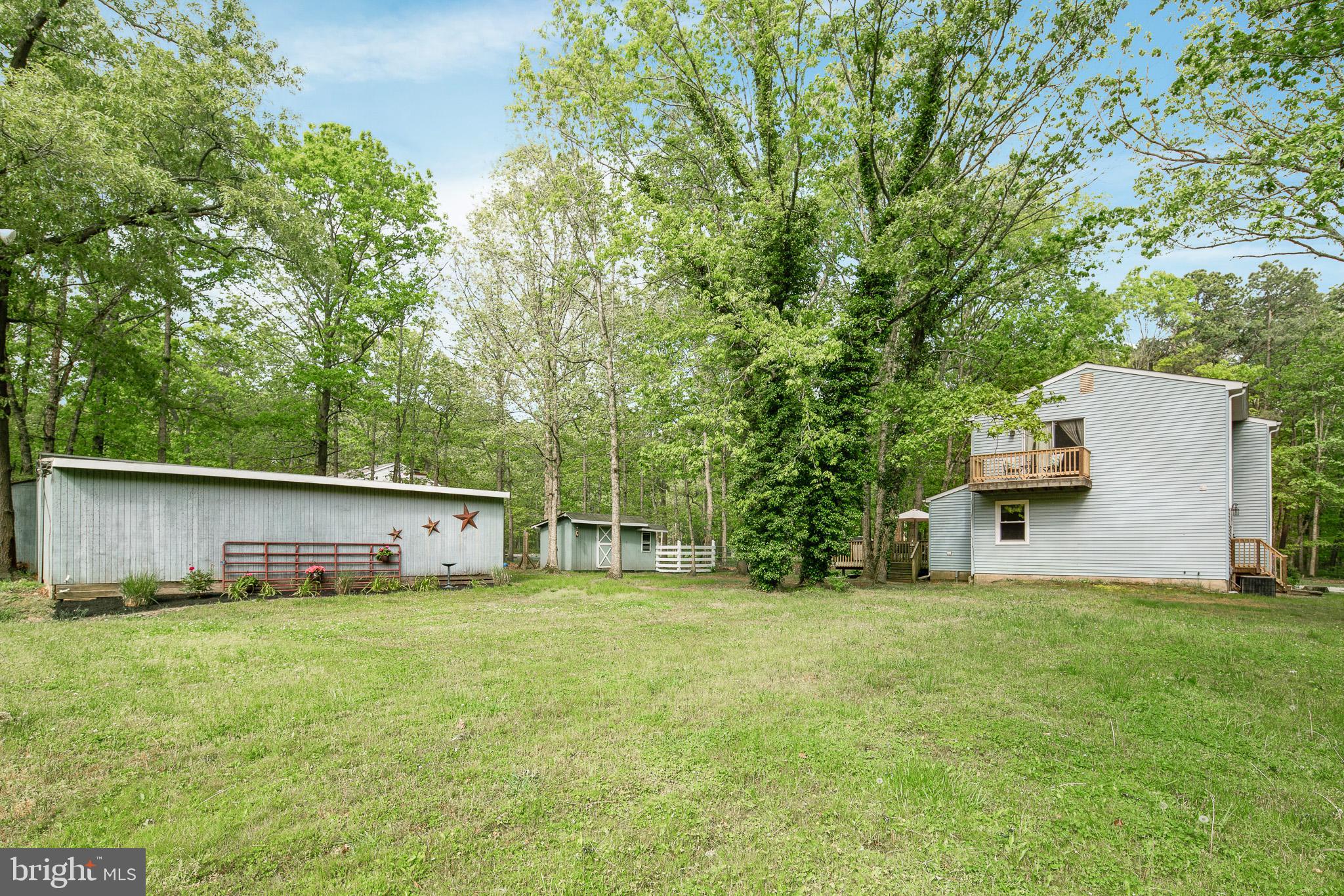 813 Whitehall Road Newfield, NJ 08344 - Photo 29 of 35 Lush green landscape surrounds the property.