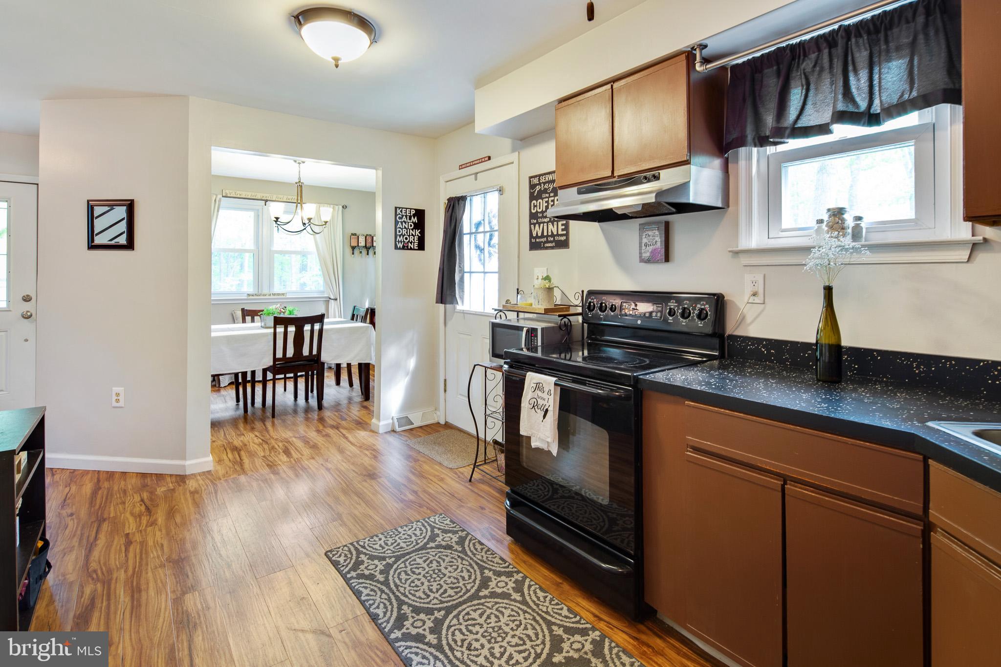813 Whitehall Road Newfield, NJ 08344 - Photo 4 of 35 Kitchen w/ sleek wood floors.