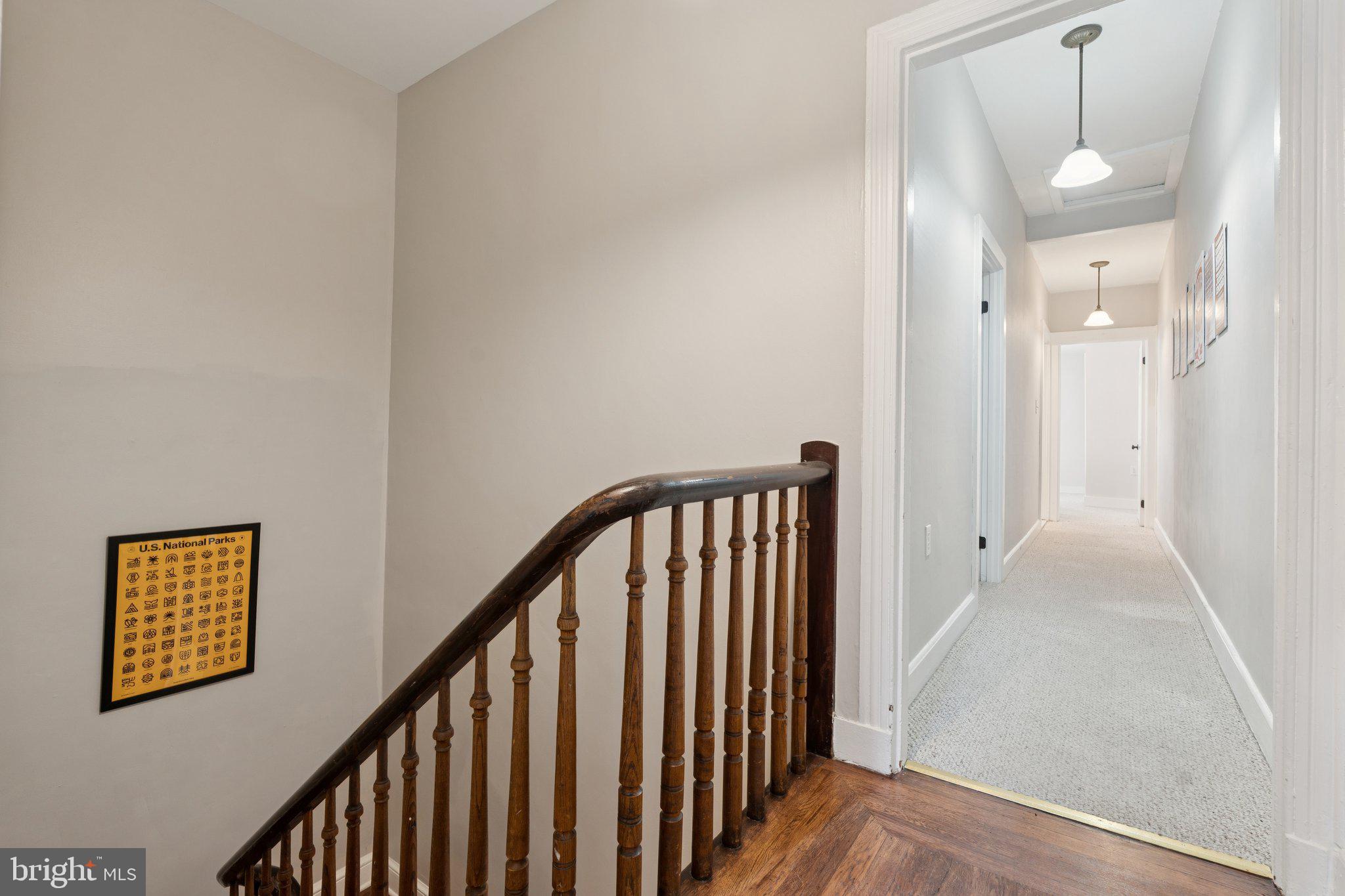 3011 O Donnell Street Baltimore, MD 21224 - Photo 17 of 33 a view of a hallway with wooden floor and staircase