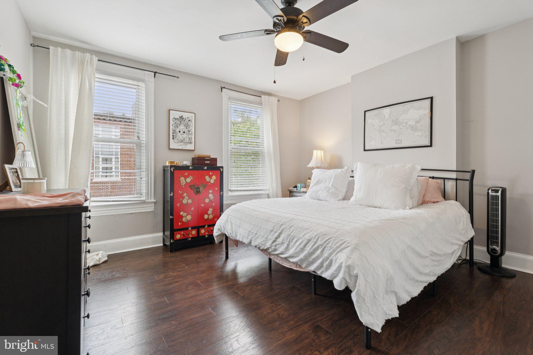 3011 O Donnell Street Baltimore, MD 21224 - Photo 18 of 33 a bedroom with a bed and wooden floor