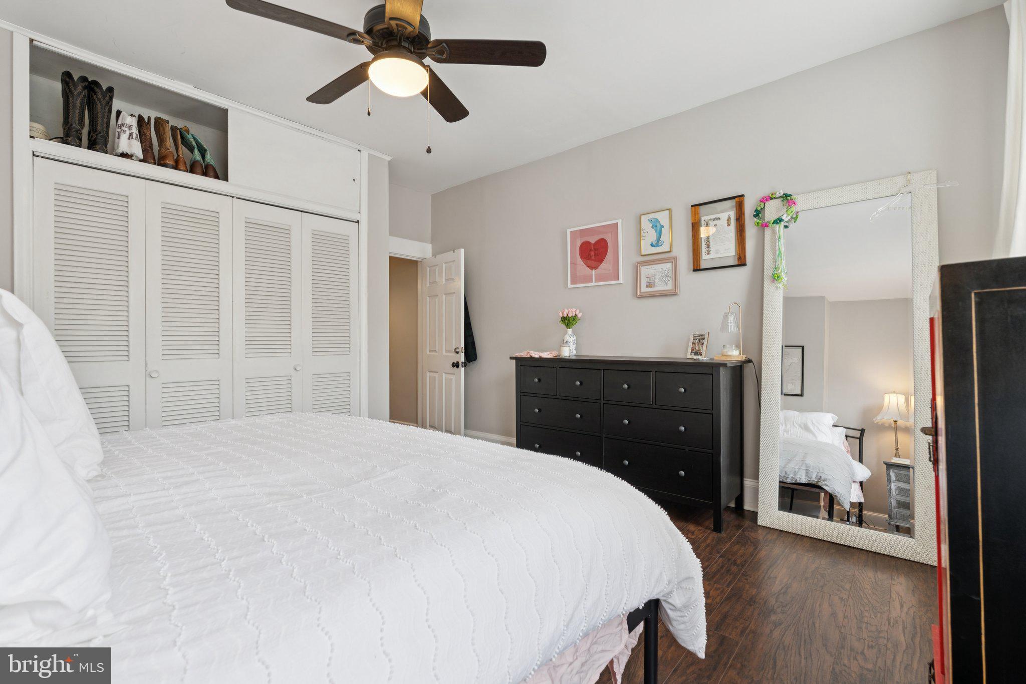 3011 O Donnell Street Baltimore, MD 21224 - Photo 21 of 33 a spacious bedroom with a bed and a chandelier
