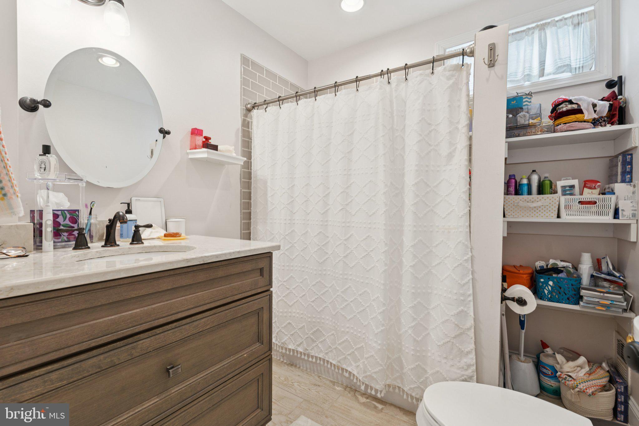 3011 O Donnell Street Baltimore, MD 21224 - Photo 25 of 33 a bathroom with a sink vanity mirror and toilet