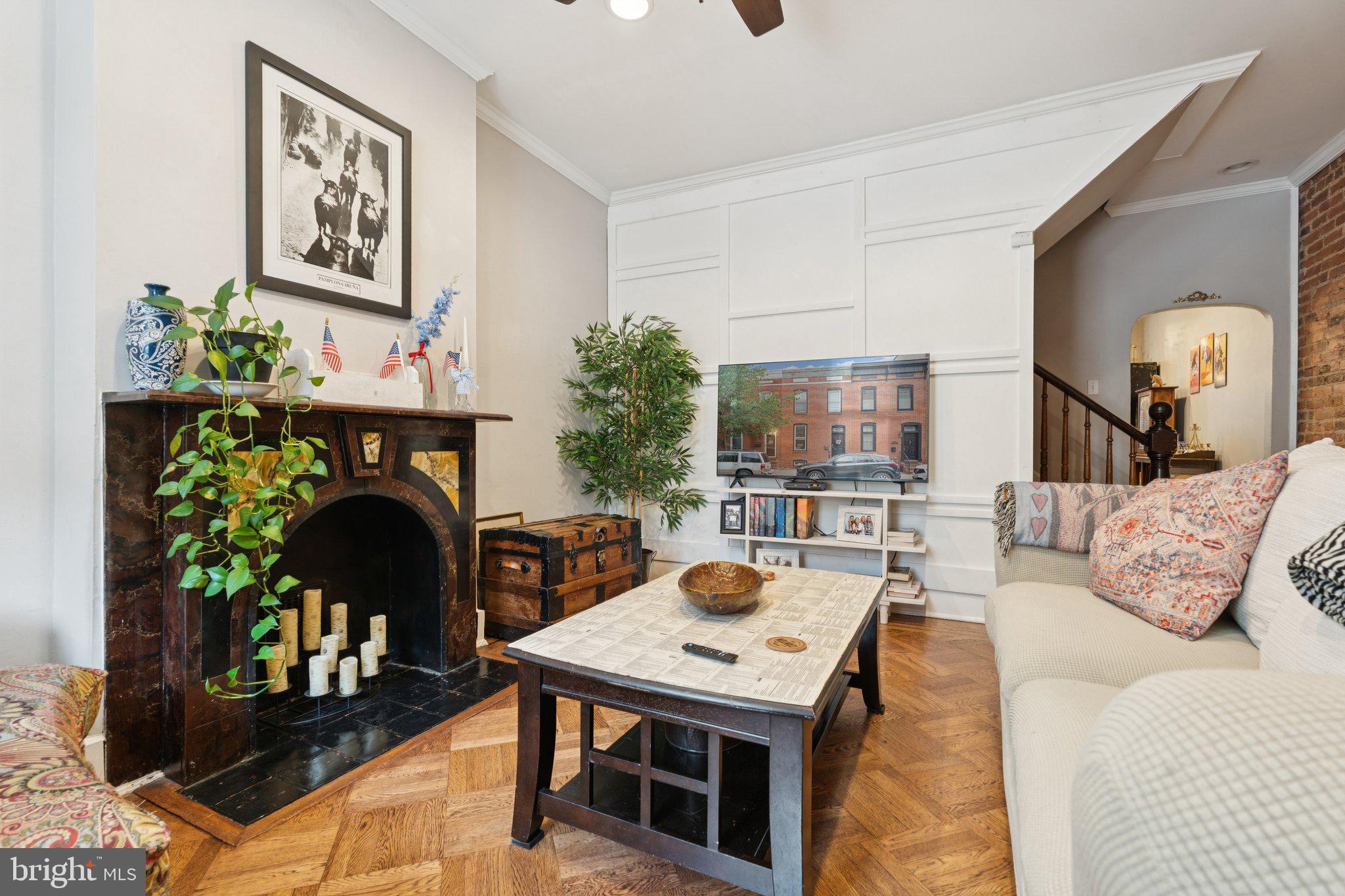 3011 O Donnell Street Baltimore, MD 21224 - Photo 6 of 33 a living room with furniture and a fireplace