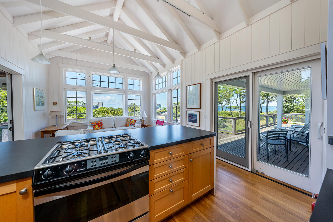 125 2nd Street Wellfleet, MA 02667 - Photo 11 of 75 a kitchen with stainless steel appliances granite countertop a stove a sink dishwasher and cabinets with wooden floor