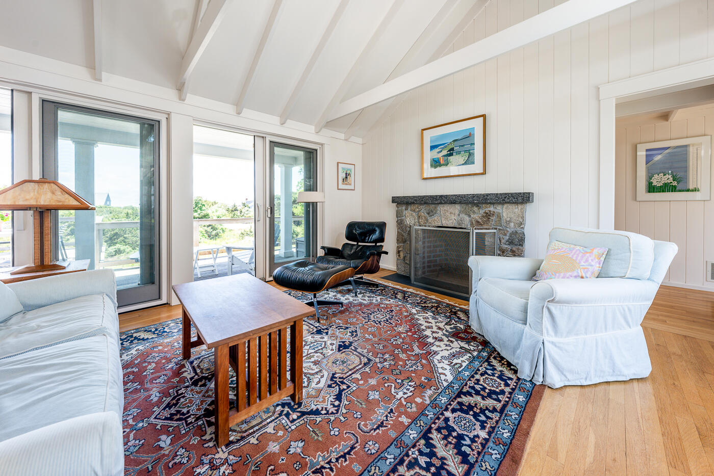 125 2nd Street Wellfleet, MA 02667 - Photo 16 of 75 a living room with furniture a large window and a fireplace