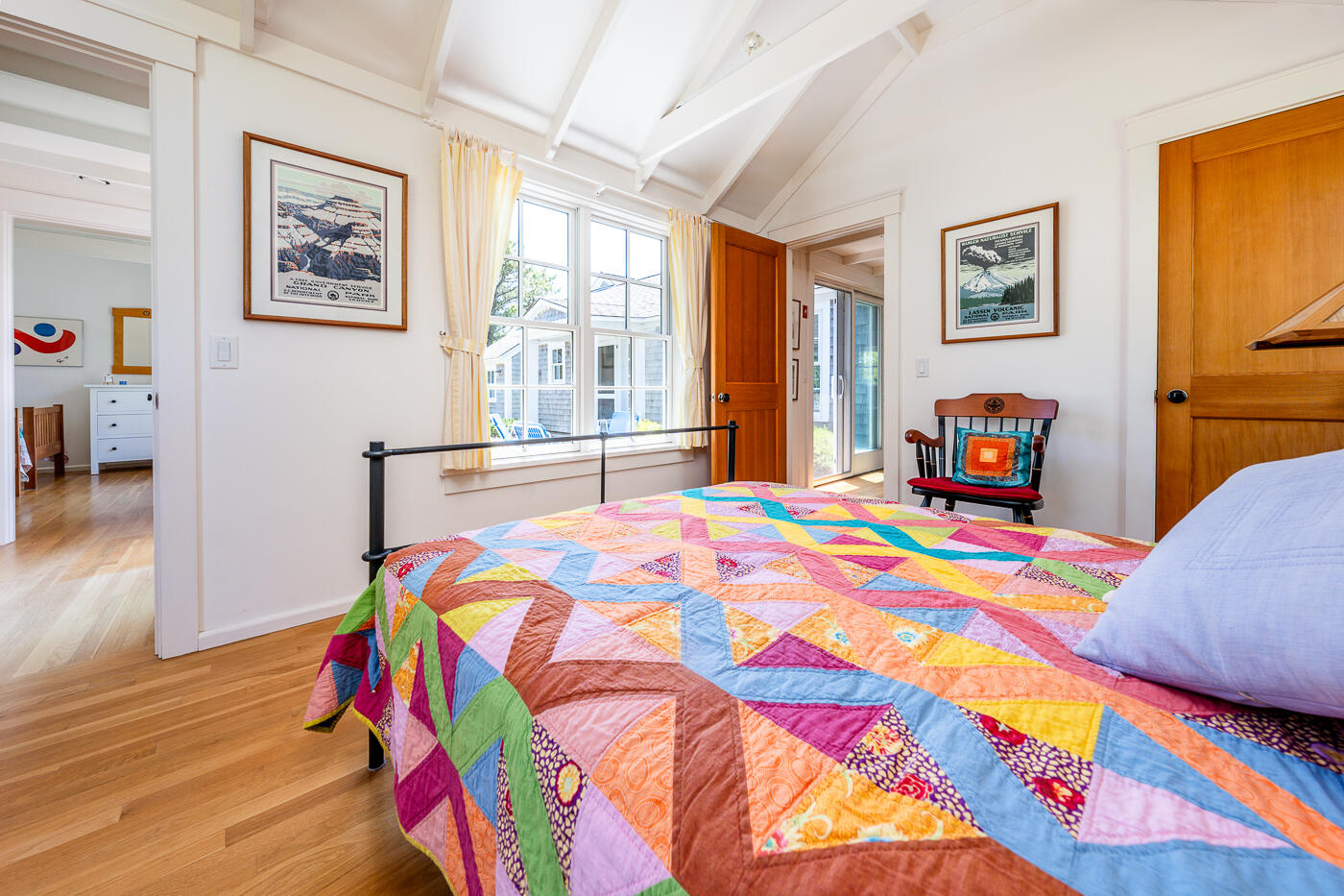 125 2nd Street Wellfleet, MA 02667 - Photo 38 of 75 a bedroom with a bed and a lamp on a table in a bedroom