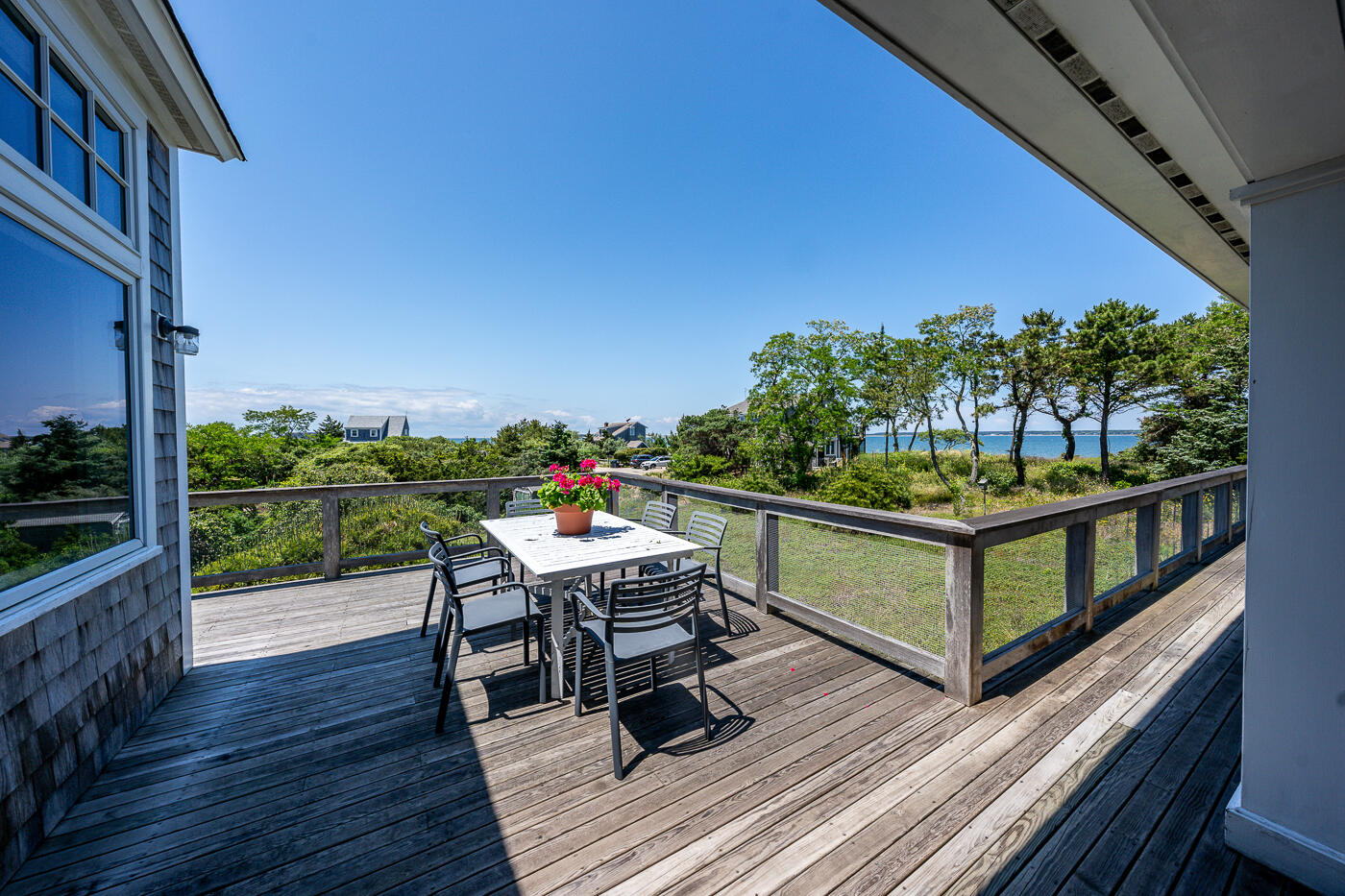 125 2nd Street Wellfleet, MA 02667 - Photo 52 of 75 a balcony with wooden floor outdoor seating and yard