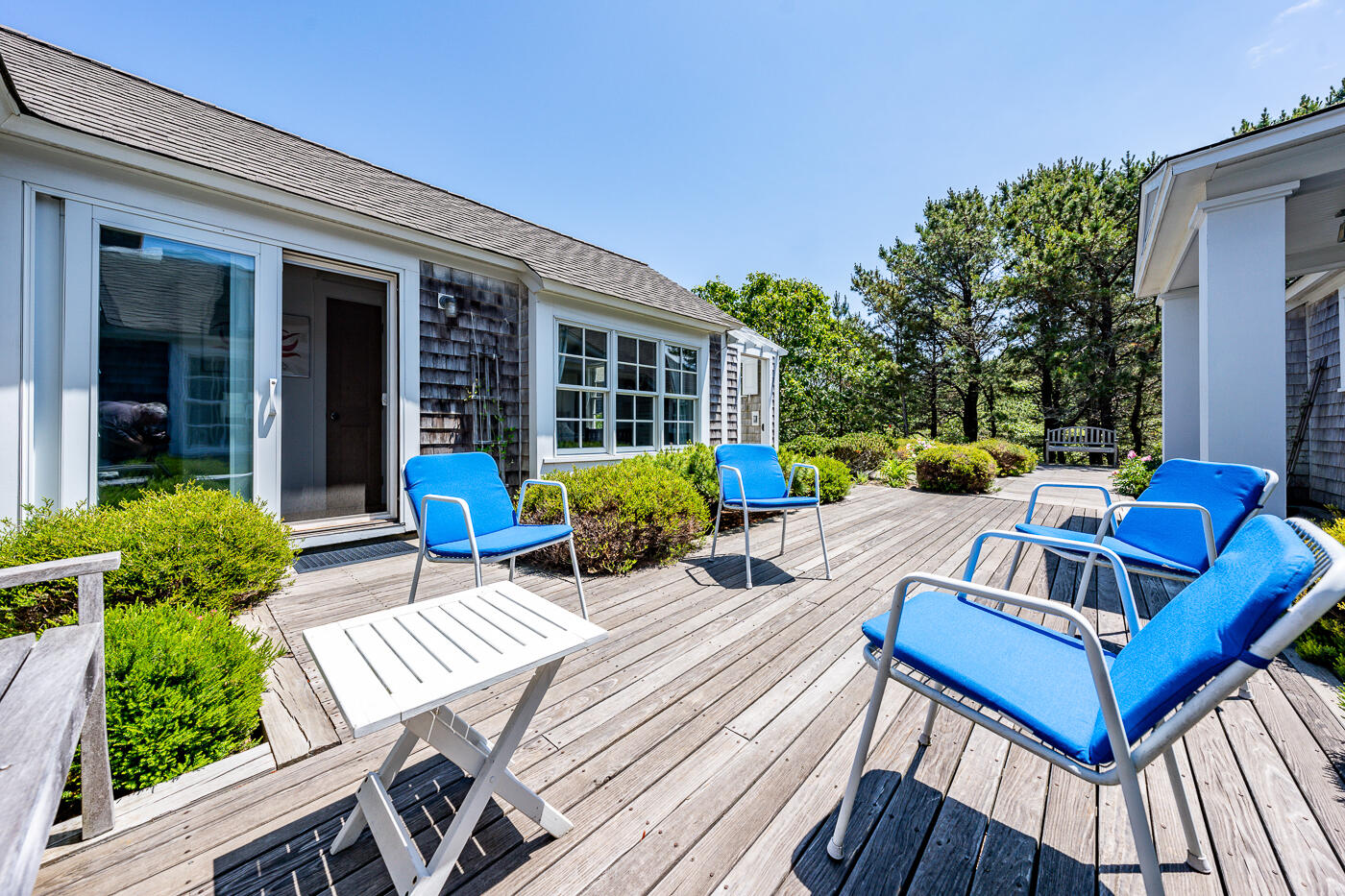 125 2nd Street Wellfleet, MA 02667 - Photo 62 of 75 a view of a patio with couches table and chairs and potted plants
