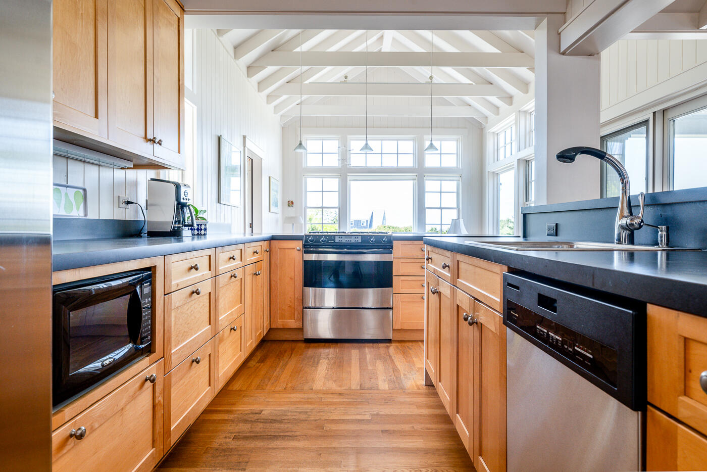 125 2nd Street Wellfleet, MA 02667 - Photo 10 of 75 a kitchen with stainless steel appliances a stove sink and cabinets