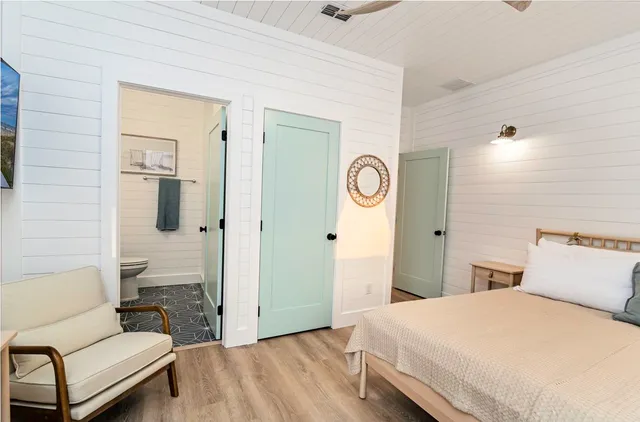 a view of swimming pool with a lounge chairs