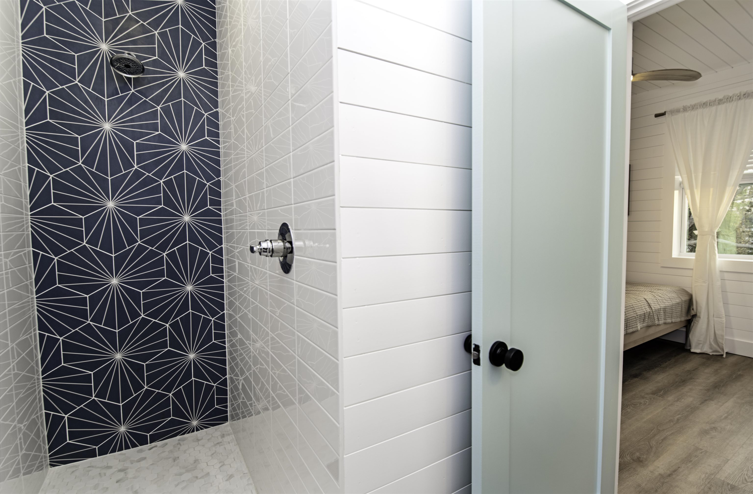 18 Inlet Place St. Augustine, FL 32080 - Photo 26 of 89 a bathroom with a shower and a window