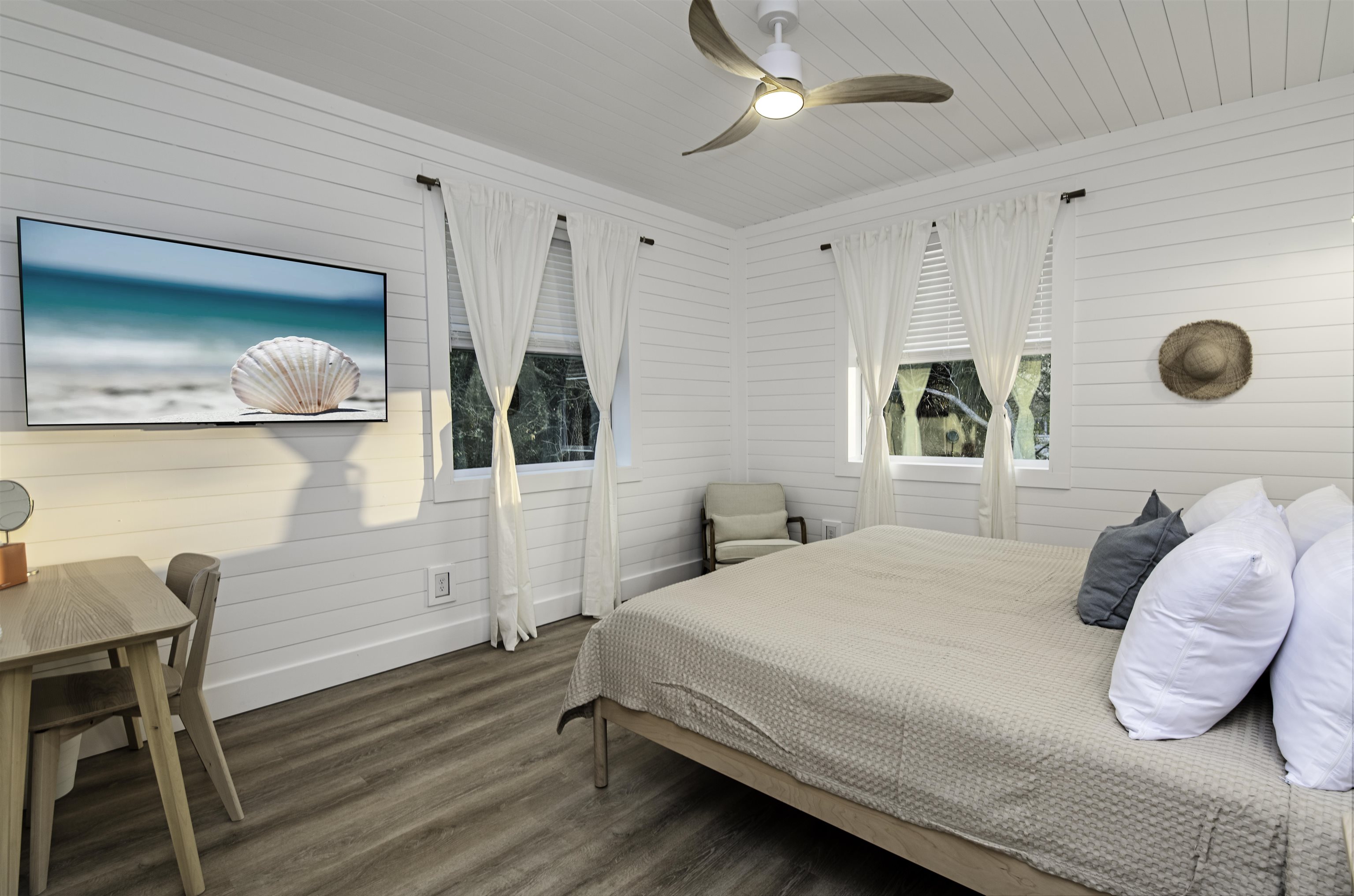 18 Inlet Place St. Augustine, FL 32080 - Photo 27 of 89 a bedroom with a bed and a chandelier