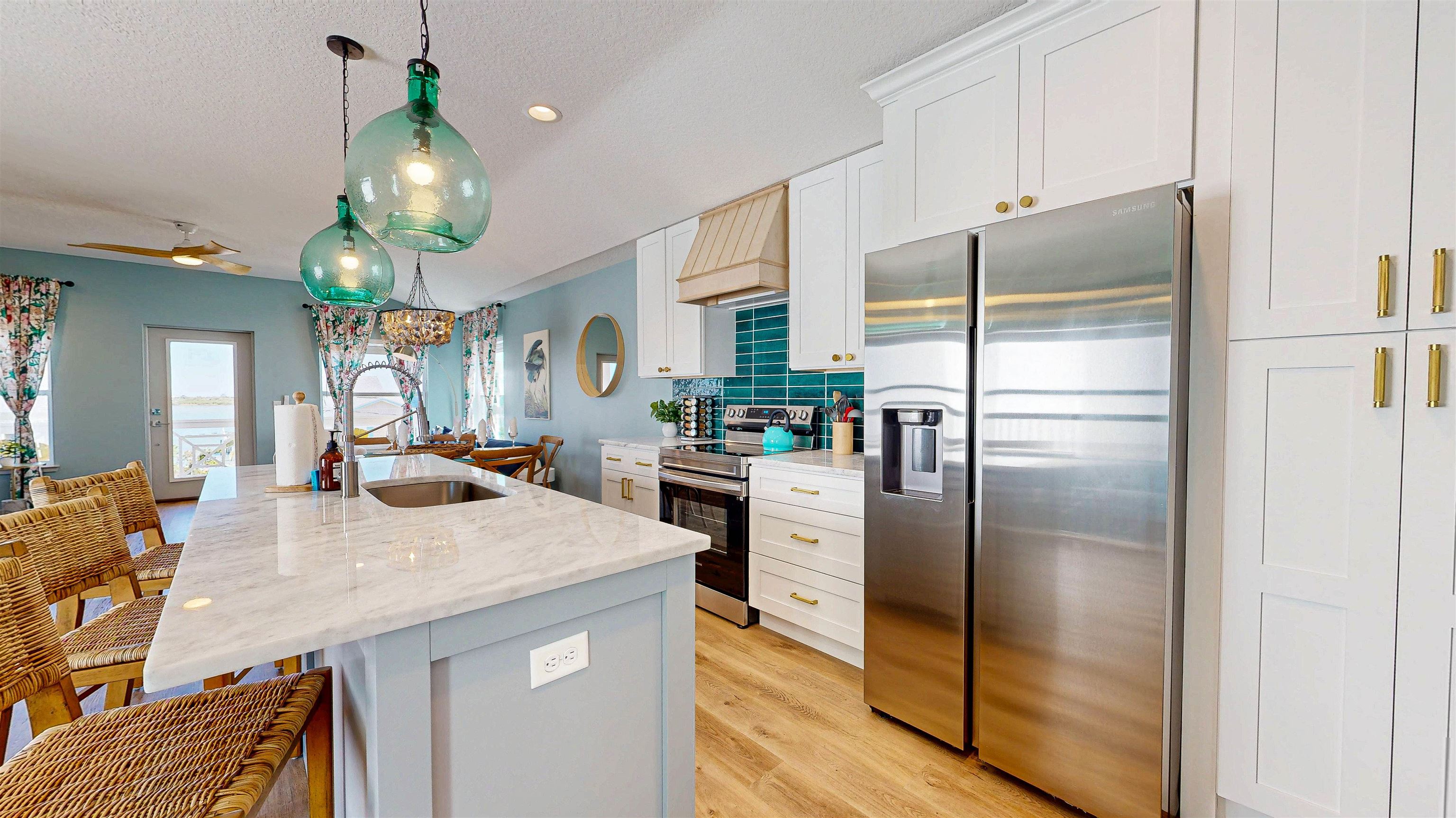 18 Inlet Place St. Augustine, FL 32080 - Photo 51 of 89 a kitchen with stainless steel appliances granite countertop a refrigerator a oven and a sink