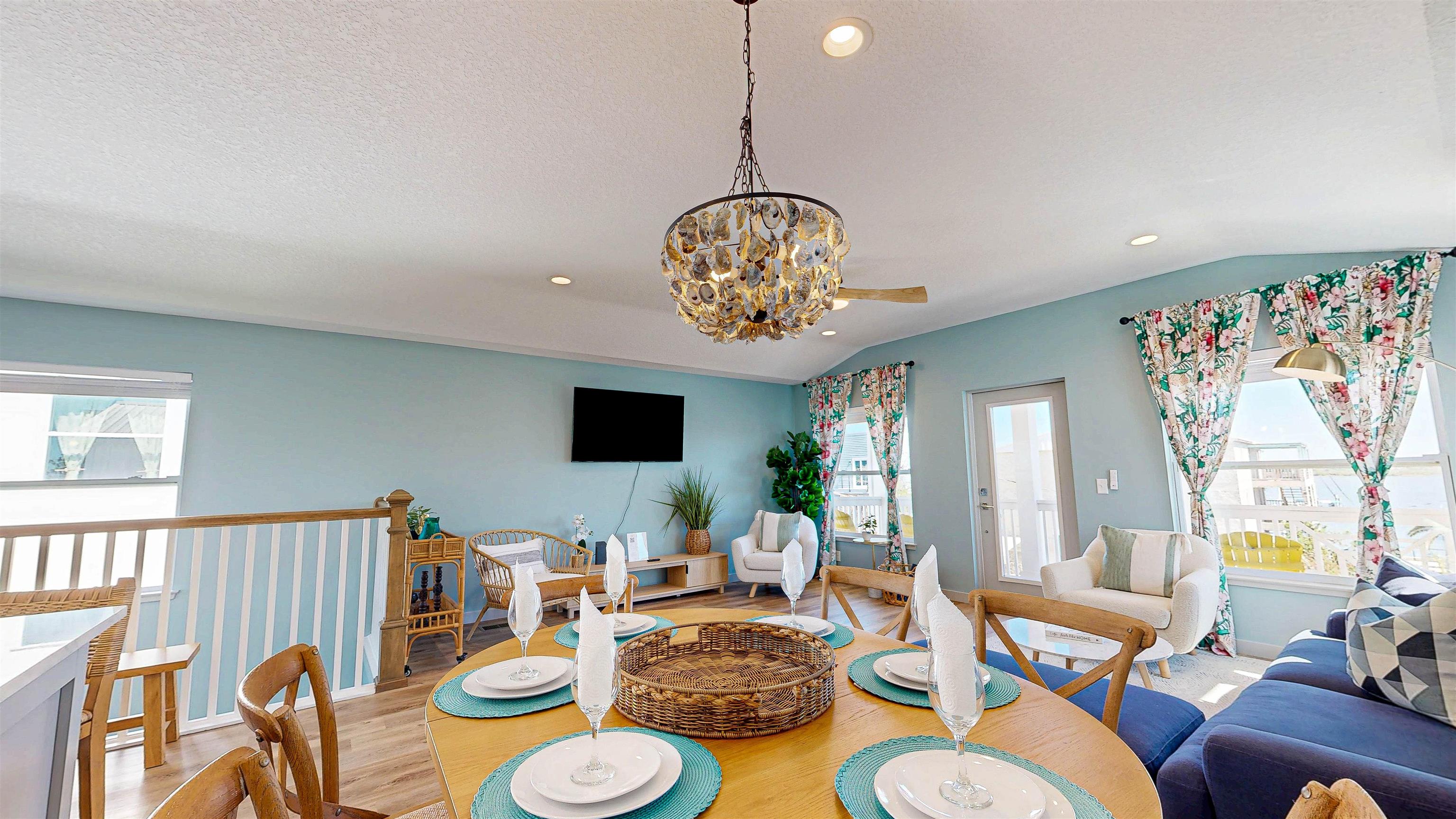 18 Inlet Place St. Augustine, FL 32080 - Photo 55 of 89 a living room with furniture a chandelier and a dining table