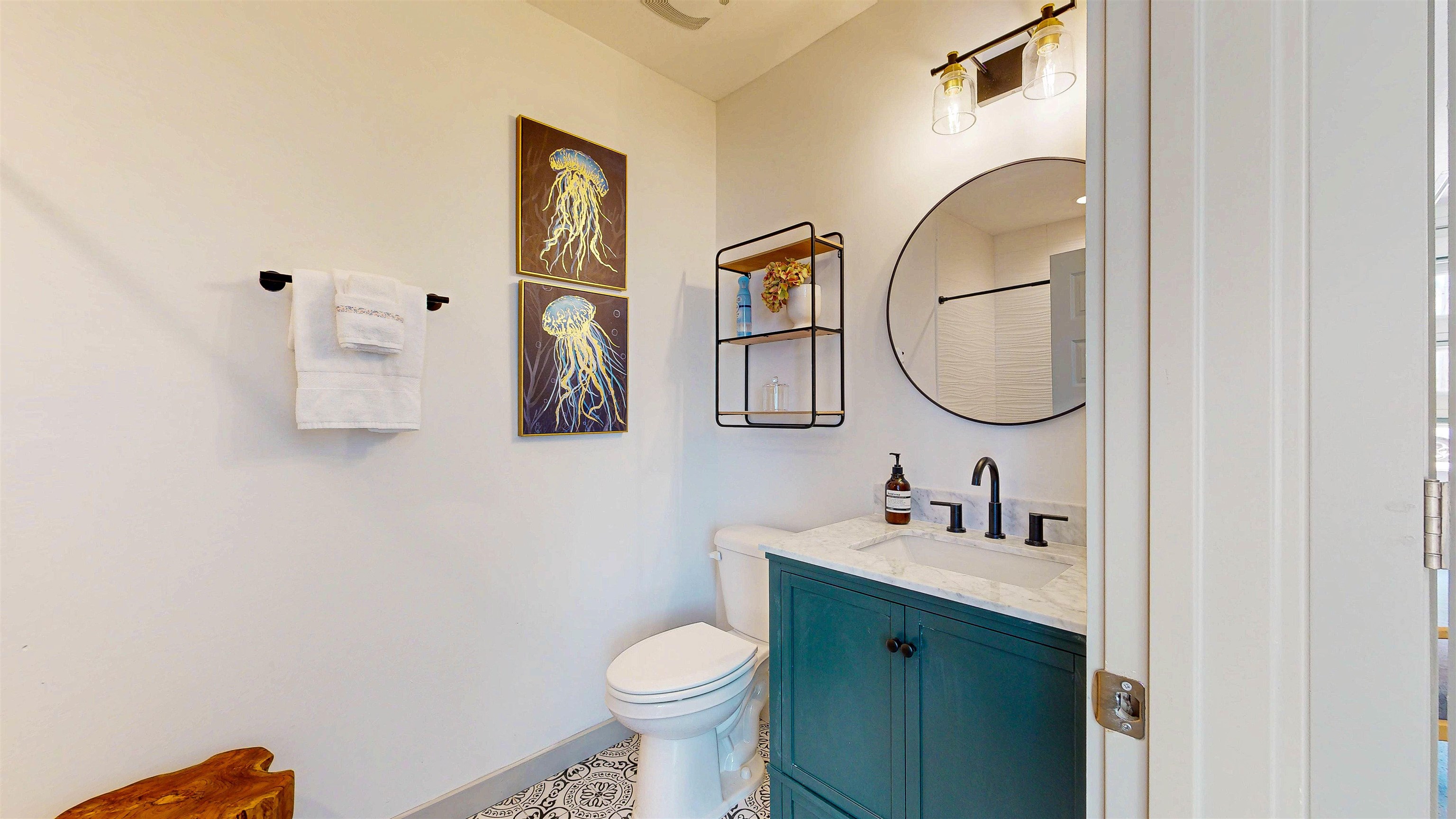 18 Inlet Place St. Augustine, FL 32080 - Photo 80 of 89 a bathroom with a toilet sink vanity and mirror