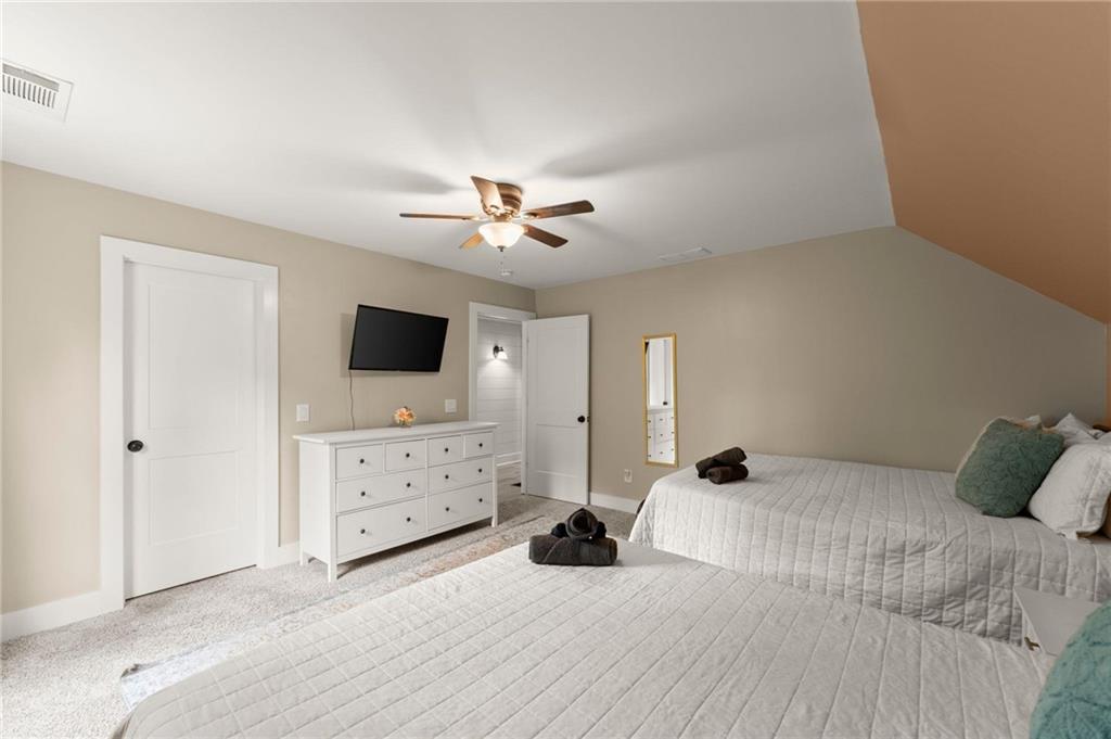 1300 Preacher Campbell Road Clarkesville, GA 30523 - Photo 22 of 34 a bedroom with a bed and a flat screen tv
