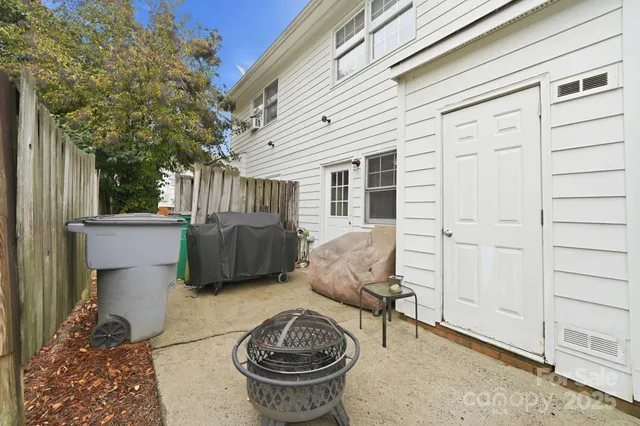 a view of a patio with couches chairs and potted plants