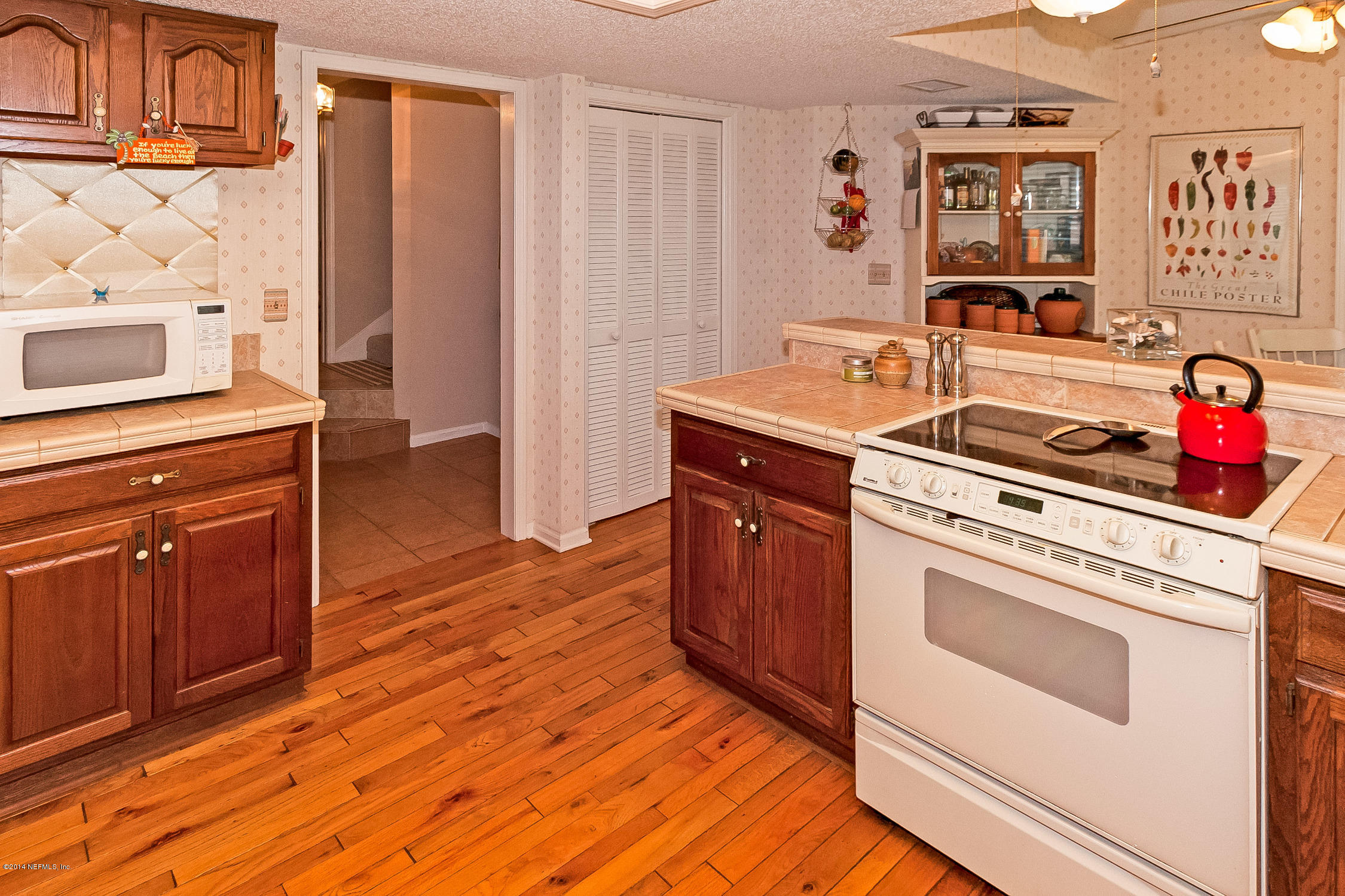 1969 Seminole Road Atlantic Beach, FL 32233 - Photo 15 of 36 a kitchen with stainless steel appliances a stove and a refrigerator