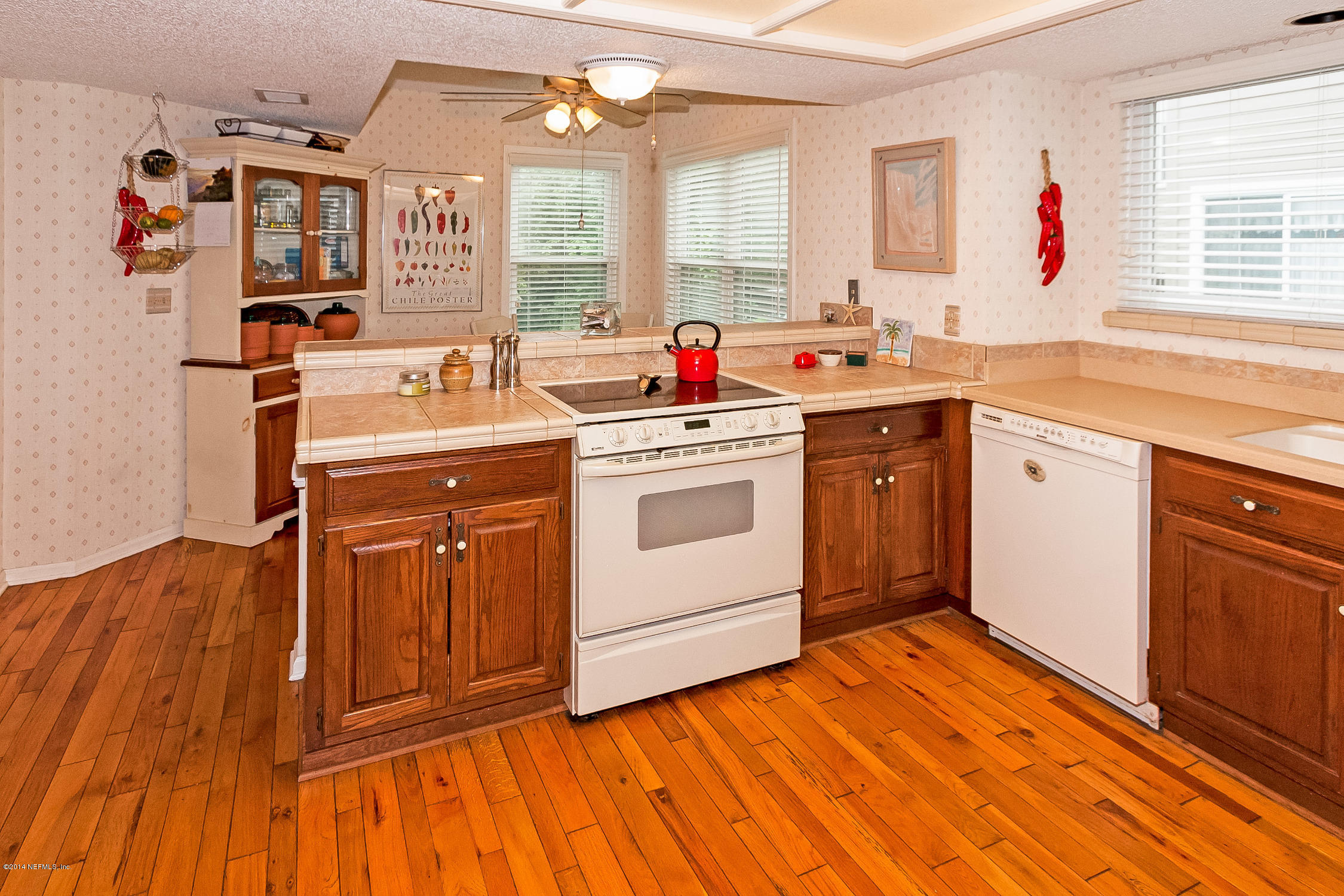 1969 Seminole Road Atlantic Beach, FL 32233 - Photo 16 of 36 a open kitchen with a sink cabinets appliances and a window