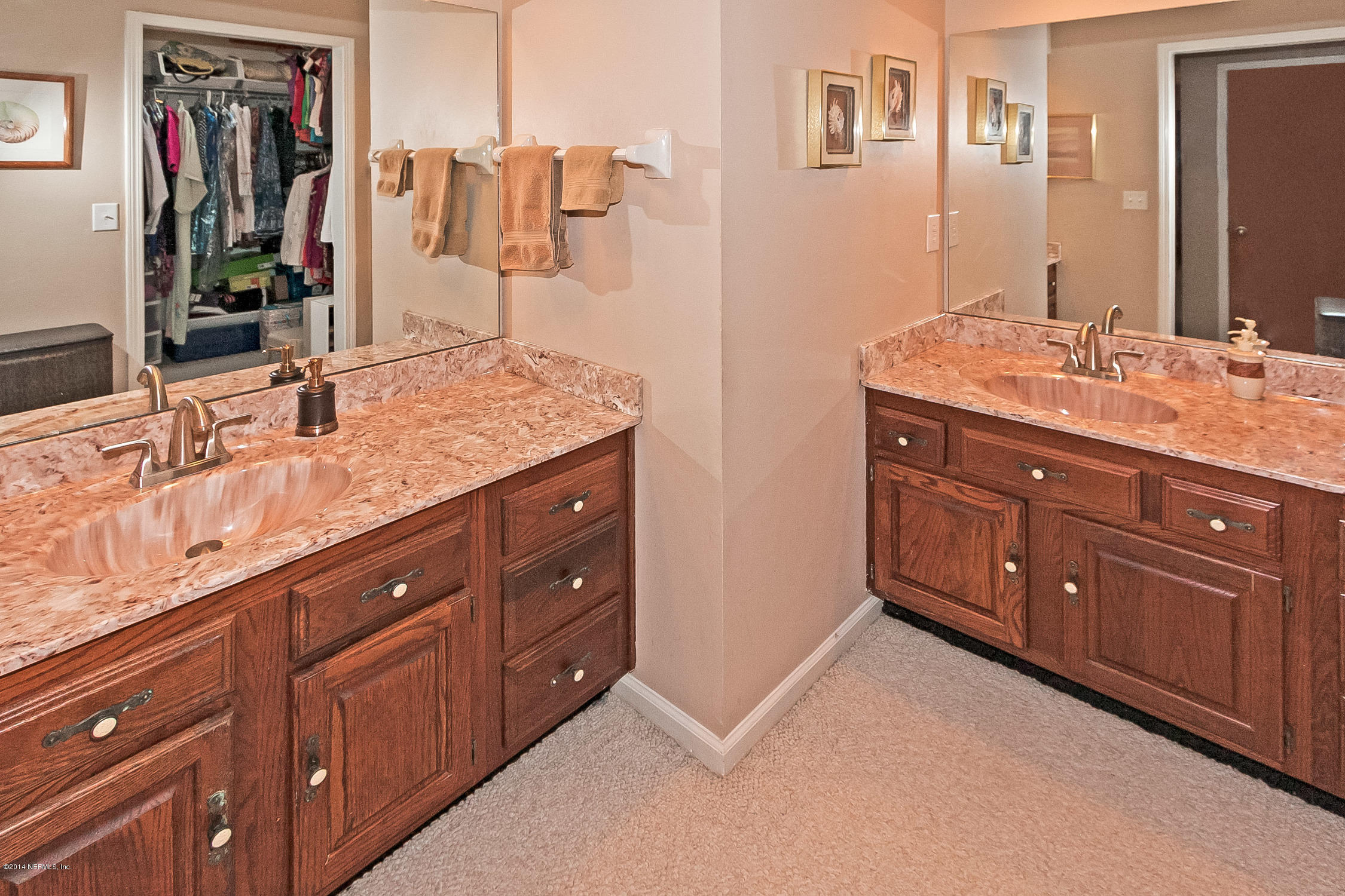 1969 Seminole Road Atlantic Beach, FL 32233 - Photo 17 of 36 a bathroom with a granite countertop double vanity sink and a mirror