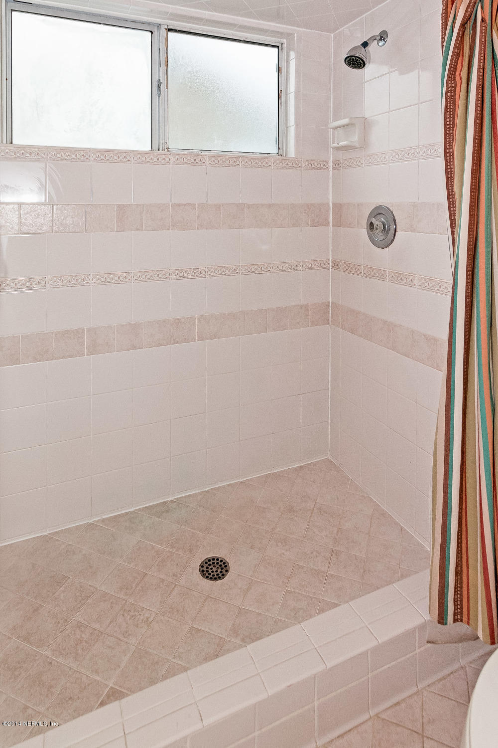 1969 Seminole Road Atlantic Beach, FL 32233 - Photo 19 of 36 a bathroom with a shower