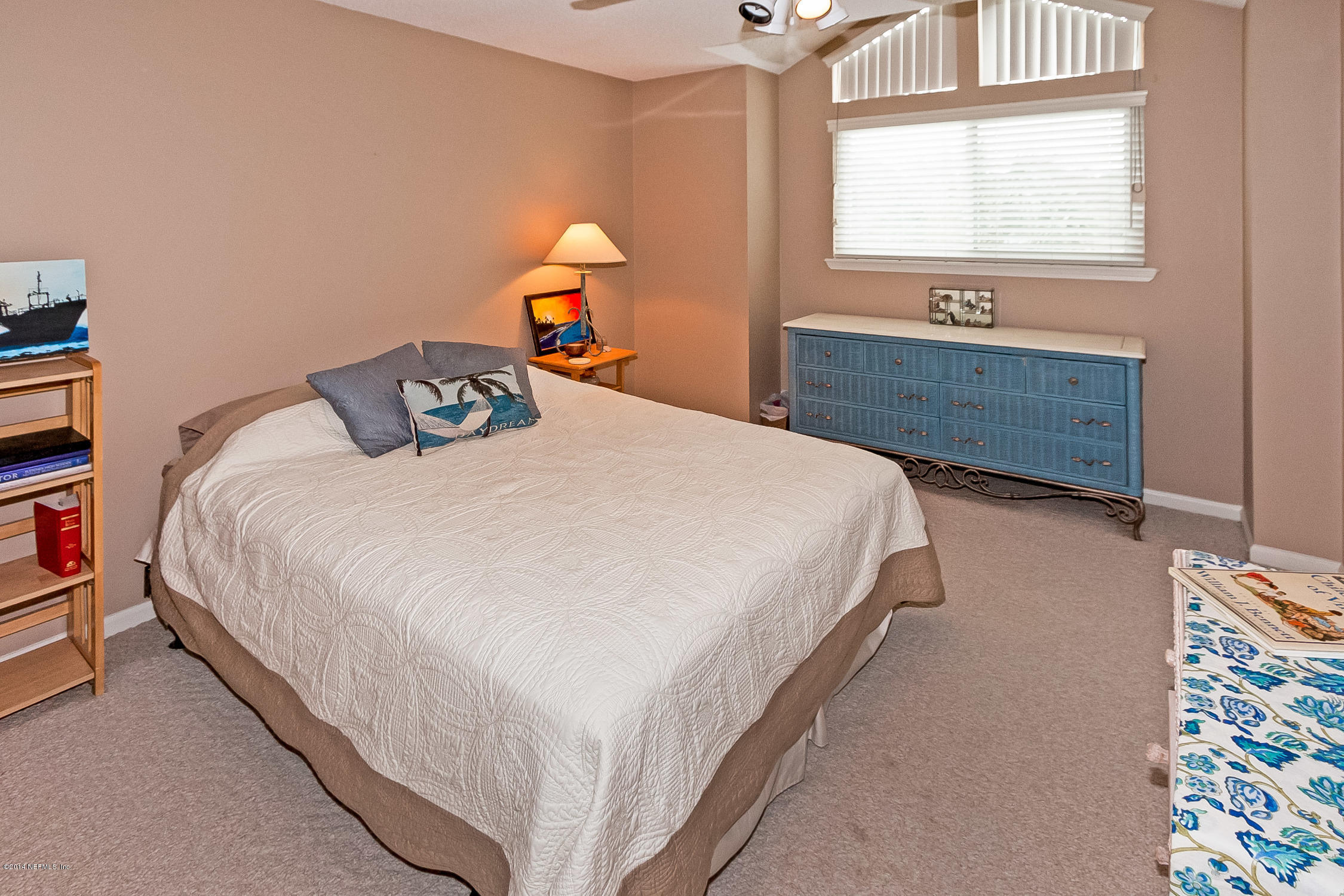 1969 Seminole Road Atlantic Beach, FL 32233 - Photo 22 of 36 a bedroom with a bed and a window