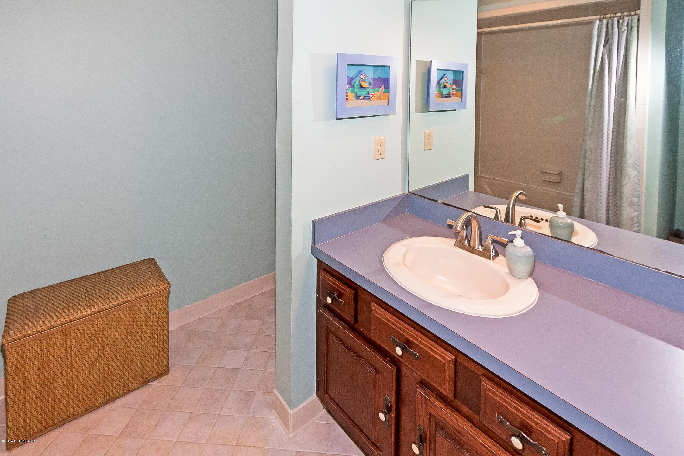 1969 Seminole Road Atlantic Beach, FL 32233 - Photo 23 of 36 a bathroom with a sink and a mirror