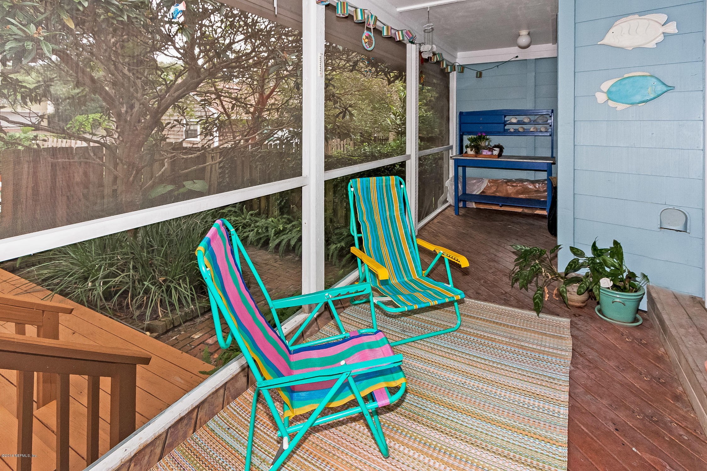 1969 Seminole Road Atlantic Beach, FL 32233 - Photo 26 of 36 a view of a balcony with a potted plant and wooden floor