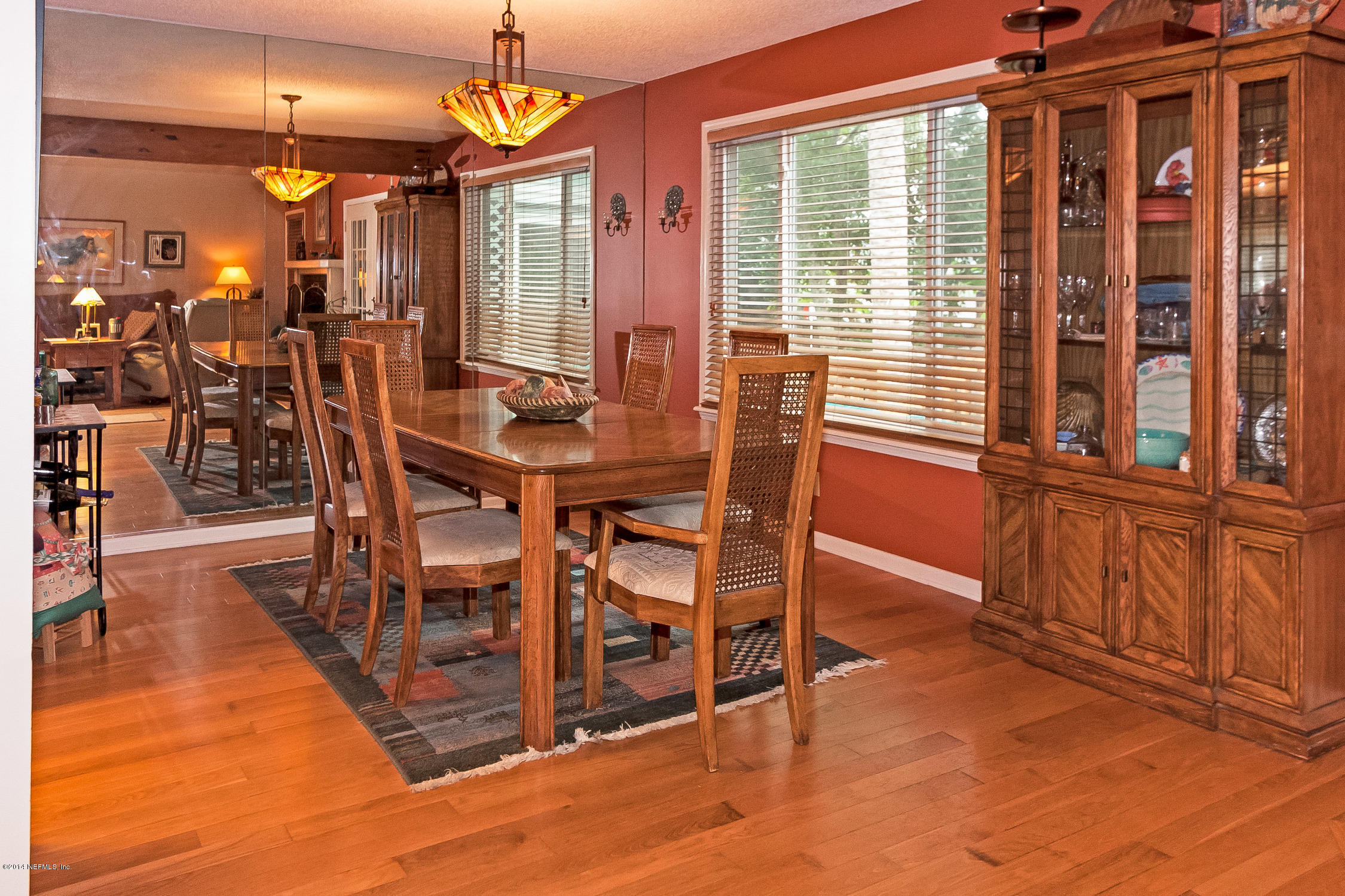 1969 Seminole Road Atlantic Beach, FL 32233 - Photo 9 of 36 a view of a dining room with furniture window and wooden floor