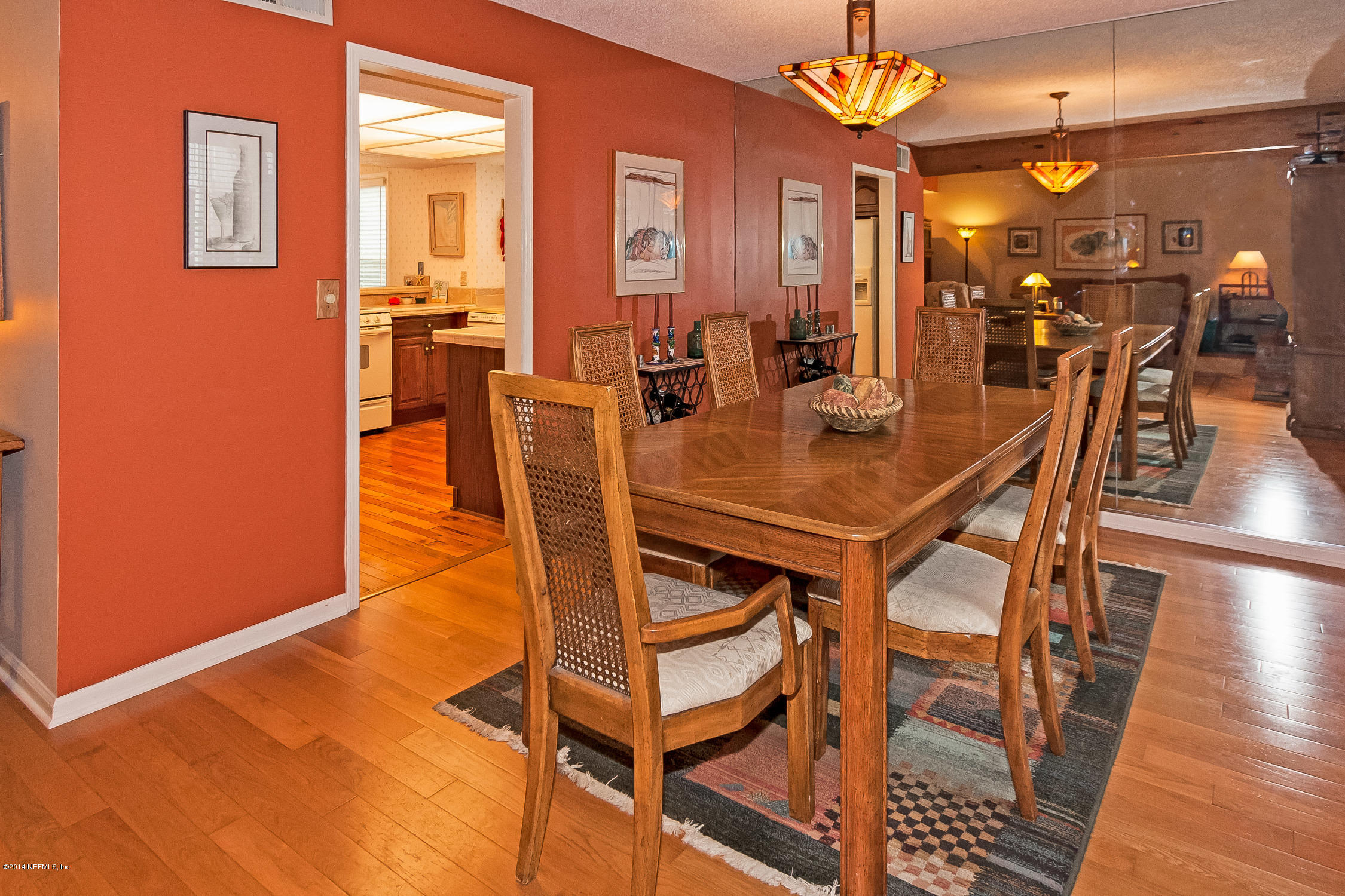 1969 Seminole Road Atlantic Beach, FL 32233 - Photo 10 of 36 a dining room with furniture and chandelier
