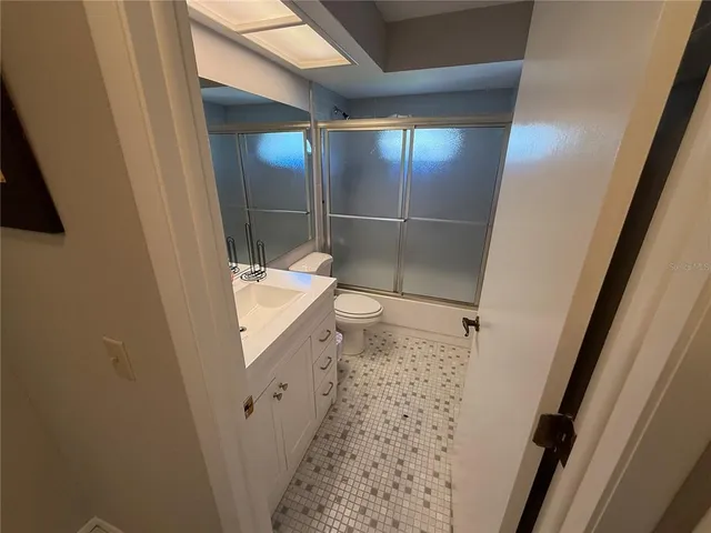a bathroom with a sink and a shower