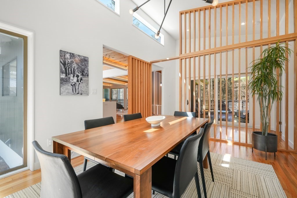 53 Beaver Road Weston, MA 02493 - Photo 11 of 38 a view of a dining room with furniture window and wooden floor