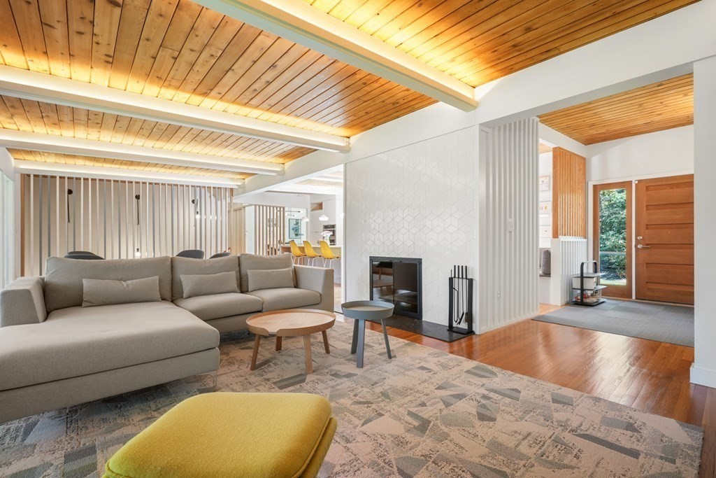 53 Beaver Road Weston, MA 02493 - Photo 13 of 38 a living room with furniture and a fireplace