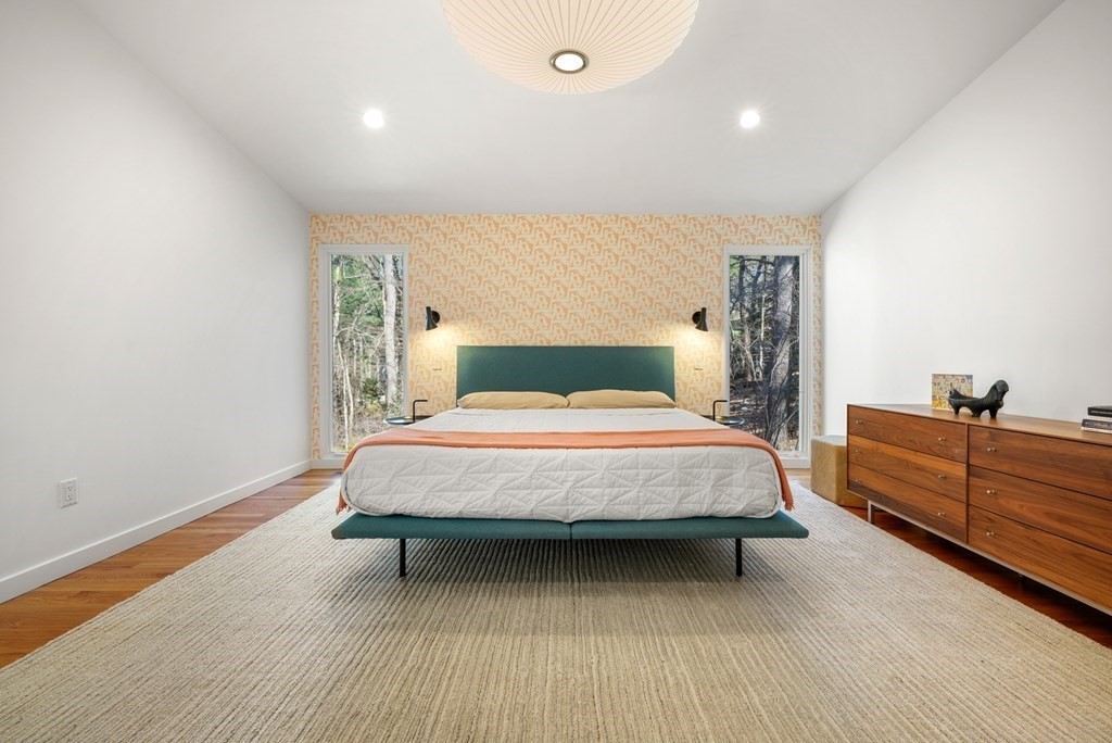 53 Beaver Road Weston, MA 02493 - Photo 17 of 38 a bed sitting in a spacious bedroom next to a window