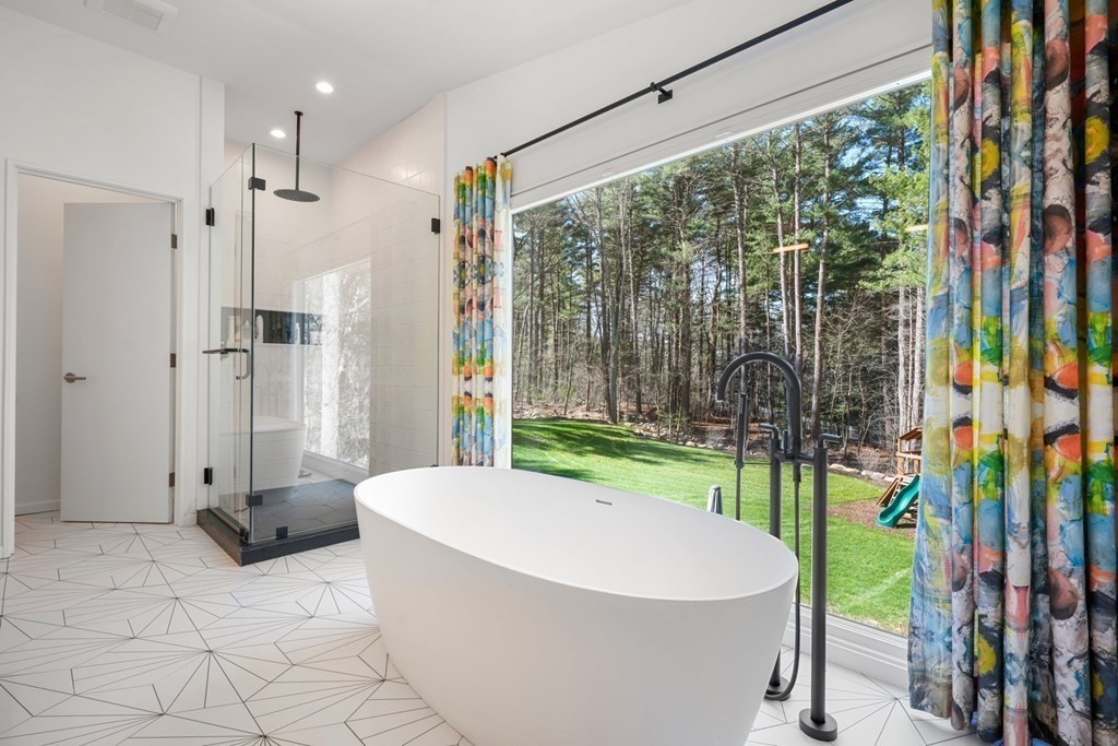 53 Beaver Road Weston, MA 02493 - Photo 18 of 38 a bathroom with a bathtub and shower