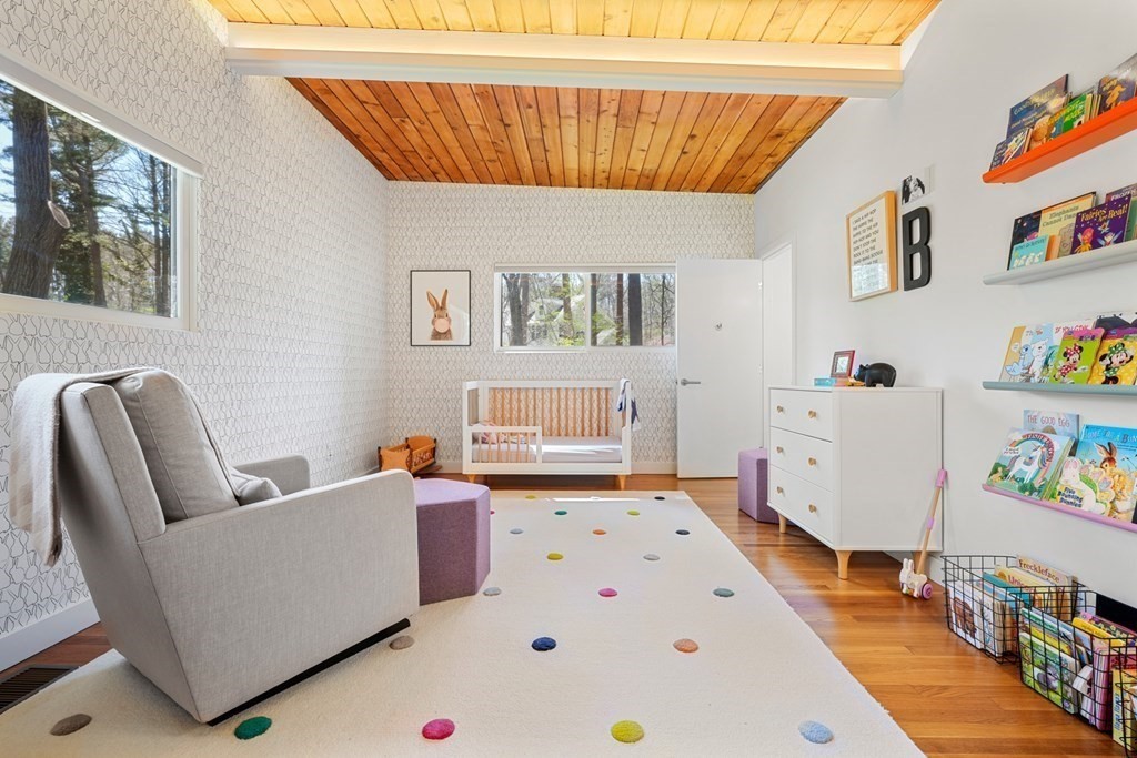 53 Beaver Road Weston, MA 02493 - Photo 20 of 38 a bedroom with furniture and a wooden floor