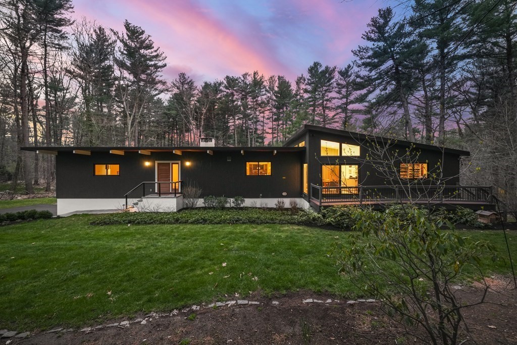 53 Beaver Road Weston, MA 02493 - Photo 2 of 38 a backyard of a house with table and chairs