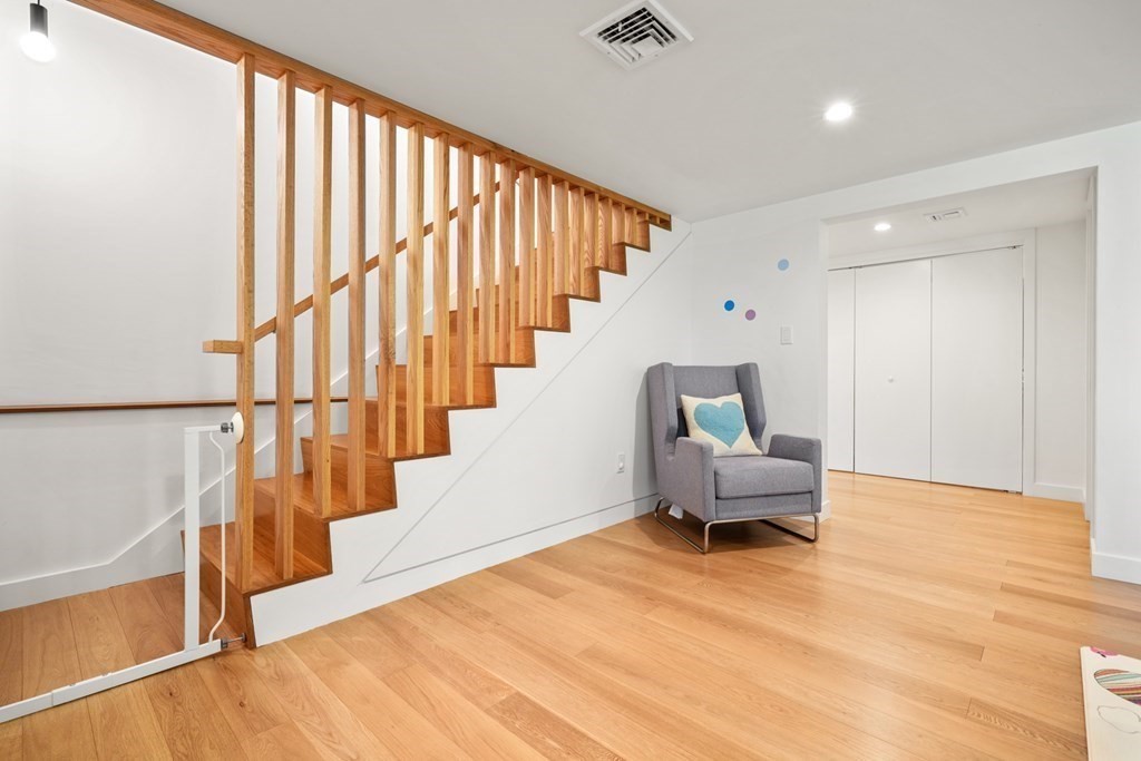 53 Beaver Road Weston, MA 02493 - Photo 27 of 38 a living room with wooden floor and furniture